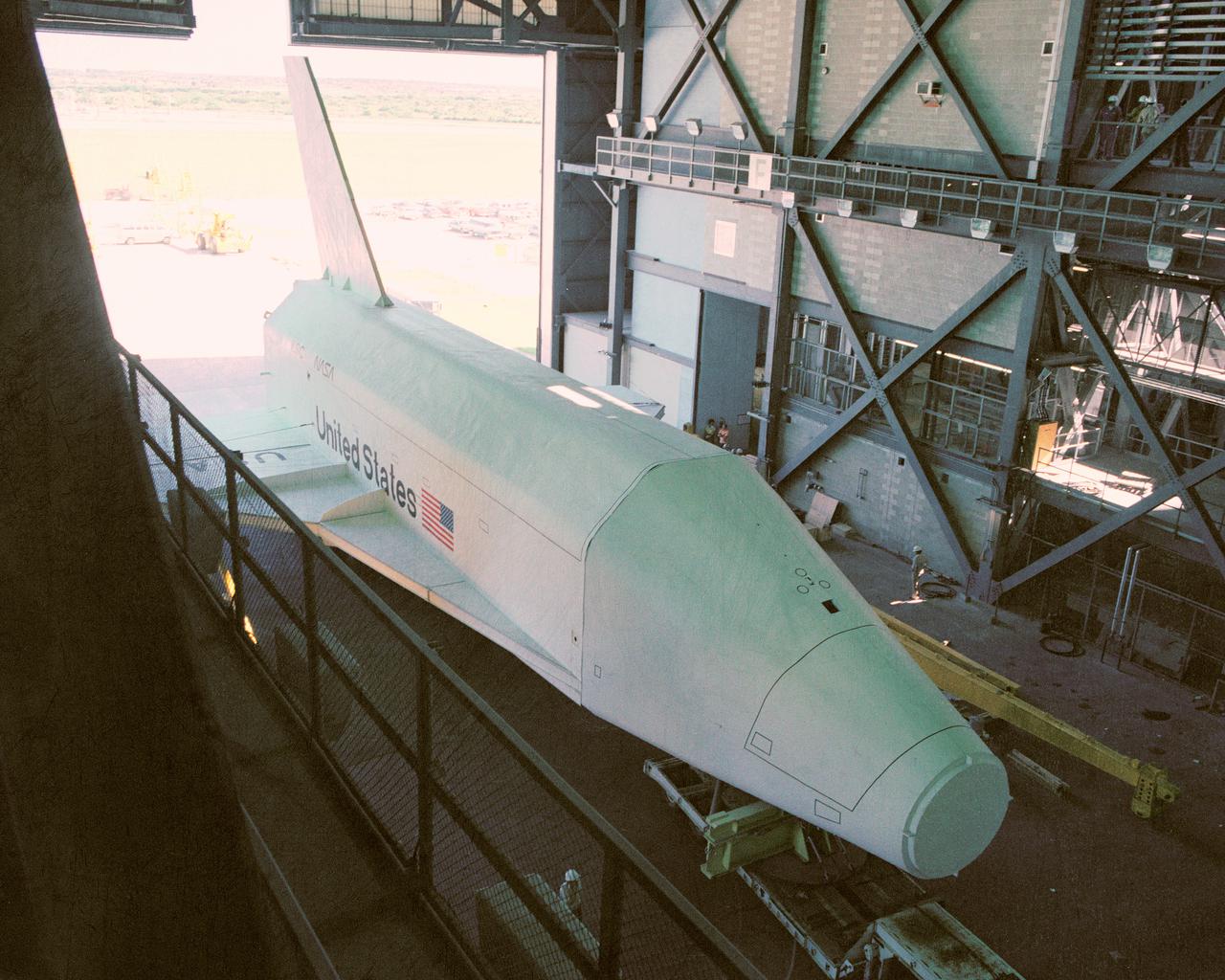 CAPE CANAVERAL, Fla. – At NASA's Kennedy Space Center in Florida, the space shuttle mock-up, dubbed Pathfinder, enters the Vehicle Assembly Building for a fit-check May 15, 1978. The mock-up, constructed at NASA's Marshall Space Flight Center in Huntsville, Ala., possessed the general dimensions, weight and balance of a real space shuttle. It was shipped to Kennedy by barge and then used to fit-check the work platforms of the Mate-Demate Device, orbiter processing facilities and Vehicle Assembly Building, as well as support ground crew training. It also was used to rehearse post-landing procedures at Kennedy's Shuttle Landing Facility.  After being on display at the 'Great Space Shuttle Exposition' in Tokyo from June 1983 to August 1984, the mock-up returned to Marshall and now is on permanent display at the U.S. Space and Rocket Center near Huntsville. Photo credit: NASA