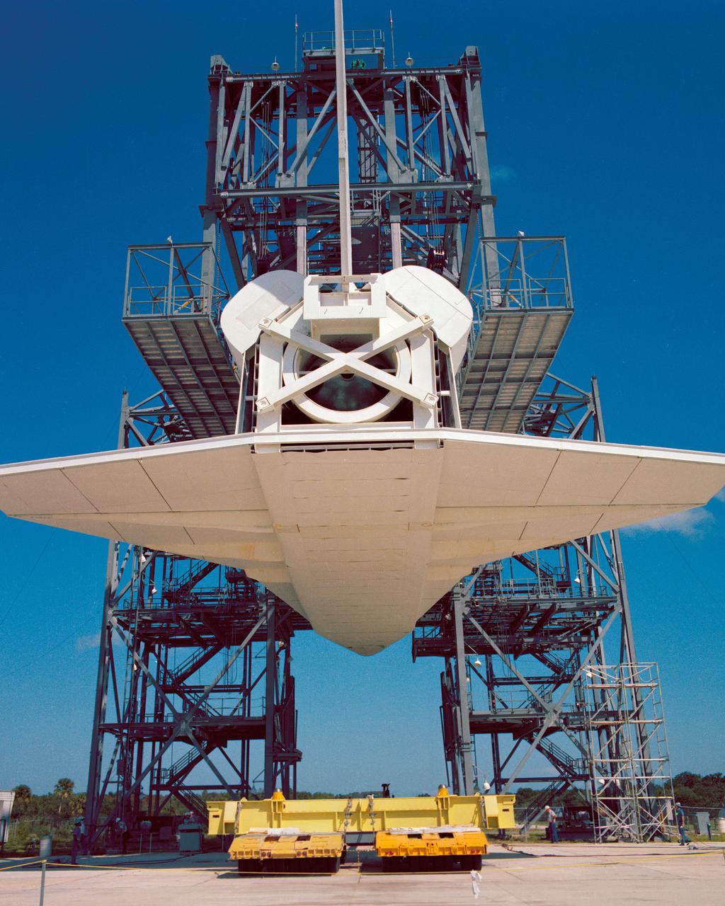 CAPE CANAVERAL, Fla. – At NASA's Kennedy Space Center in Florida, the space shuttle mock-up, dubbed Pathfinder, is attached to the Mate-Demate Device for at fit-check Oct. 19, 1978. The mock-up, constructed at NASA's Marshall Space Flight Center in Huntsville, Ala., possessed the general dimensions, weight and balance of a real space shuttle. It was shipped to Kennedy by barge and then used to fit-check the work platforms of the Mate-Demate Device, orbiter processing facilities and Vehicle Assembly Building, as well as support ground crew training. It also was used to rehearse post-landing procedures at Kennedy's Shuttle Landing Facility.  After being on display at the 'Great Space Shuttle Exposition' in Tokyo from June 1983 to August 1984, the mock-up returned to Marshall and now is on permanent display at the U.S. Space and Rocket Center near Huntsville. Photo credit: NASA