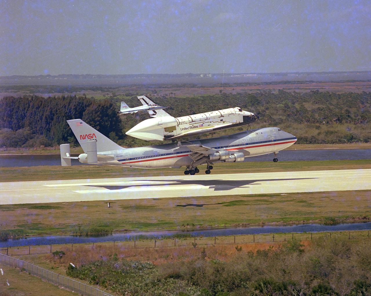 KENNEDY SPACE CENTER, FLA. - The Space Shuttle Columbia, piggy-back on its 747 carrier aircraft, is only seconds away from a touchdown at Kennedy Space Center’s Shuttle Landing Facility (SLF), completing its 2,400 mile ferry flight from Dryden Flight Research Center in California. Columbia, the first of the fleet of Space Shuttles, is scheduled for the first Space Shuttle flight in 1981.