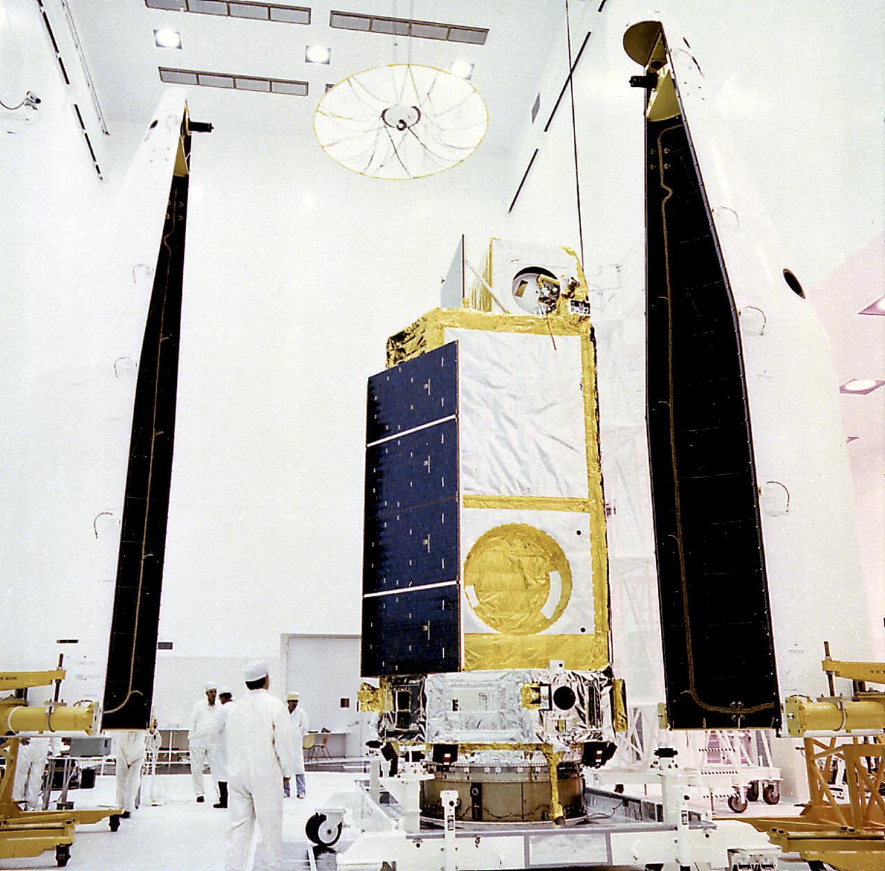 This photograph was taken during encapsulation of the High Energy Astronomy Observatory (HEAO)-3. Designed and developed by TRW, Inc. under the direction of the Marshall Space Flight Center, the objectives of the HEAO-3 were to survey and map the celestial sphere for gamma-ray flux and make detailed measurements of cosmic-ray particles. It carried three scientific experiments: a gamma-ray spectrometer, a cosmic-ray isotope experiment, and a heavy cosmic-ray nuclei experiment. The HEAO-3 was originally identified as HEAO-C but the designation was changed once the spacecraft achieved orbit. The Marshall Space Flight Center had the project management responsibilities for the HEAO missions. 
