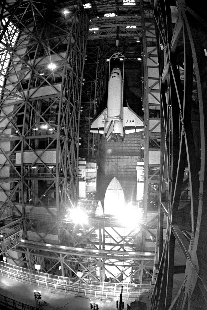 KENNEDY SPACE CENTER, FLA. - Shuttle Orbiter Columbia lift and mate to external tank in the Vehicle Assembly Building (VAB).