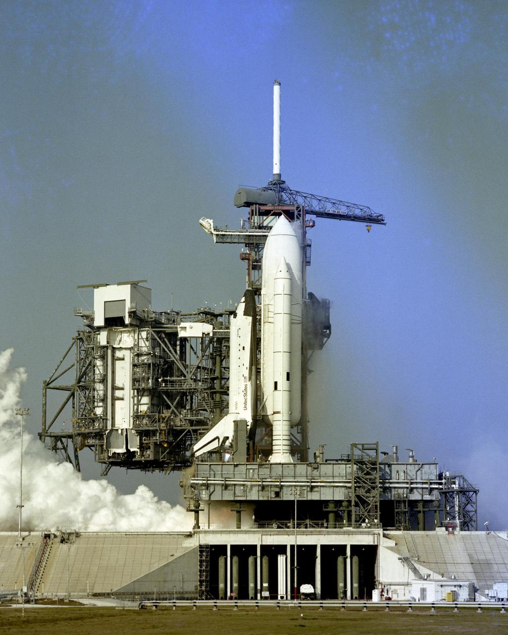 KENNEDY SPACE CENTER, FLA.  - Flames shoot from the nozzles of Space Shuttle Columbia's three main engines during the successful 20-second static firing which capped a formal rehearsal for the maiden flight of Columbia, scheduled for early April.  Remotely operated cameras inside the pad perimeter snapped closeup views of the milestone event, which took place at 8:45 a.m. on February 20, 1981.  The three main engines reached 100 percent power -- over 1 million pounds of thrust -- during the test.  Hold-down bolts secured the vehicle to its mobile launcher platform.