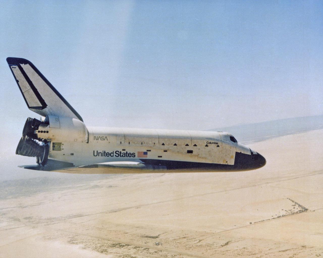 DRYDEN FLIGHT RESEARCH CENTER, CALIF.  -   Columbia returns to Earth.  Completing the first full test of the Space Transportation System (STS-1), the orbiter Columbia is seen here on its final approach prior to landing on Rogers dry lake, Runway 23, at NASA's Dryden Flight Research Center, Edwards, California.  For this first flight the Columbia was flown by astronauts John Young, commander, and Robert Crippen,  pilot.