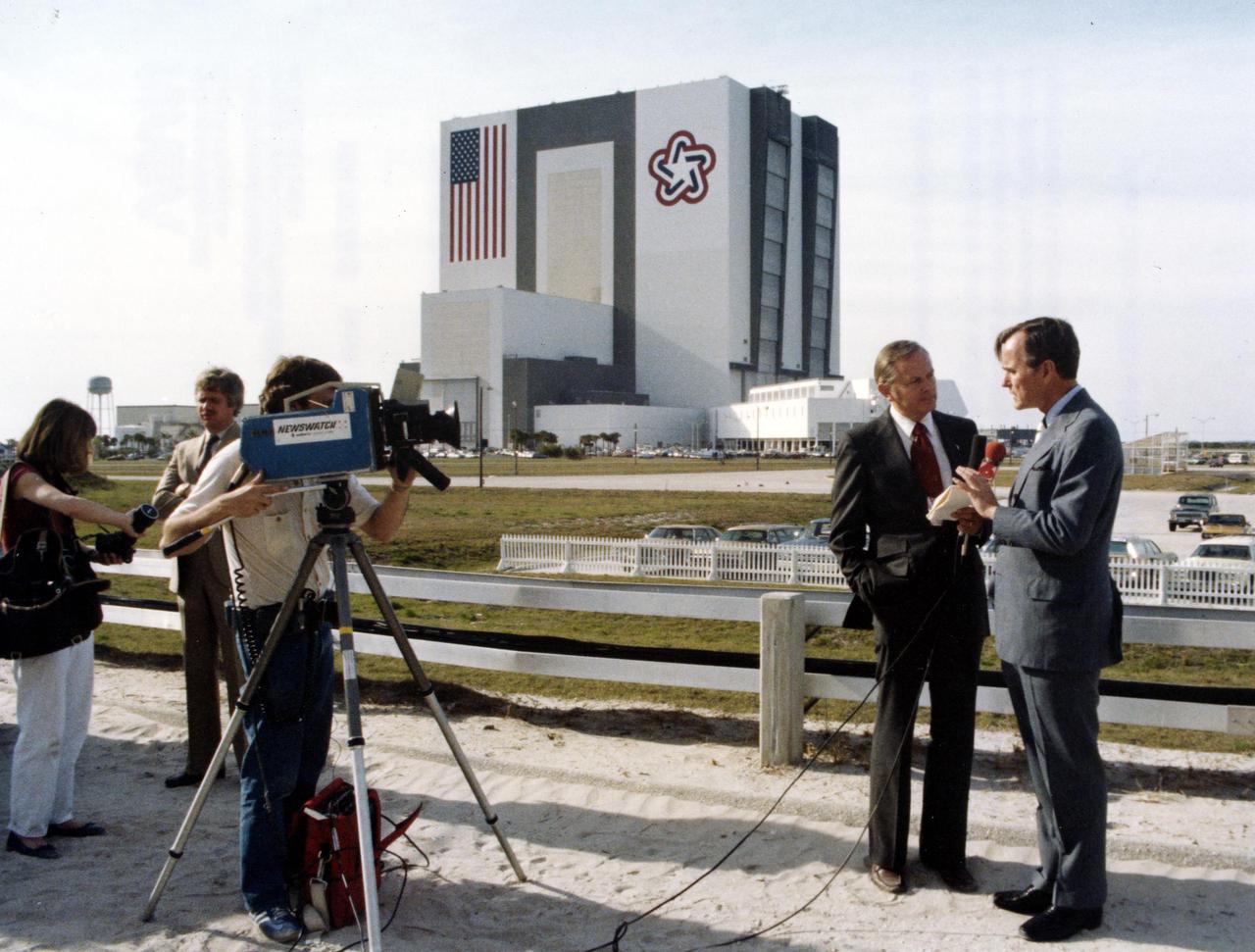 KENNEDY SPACE CENTER, FLA. -- Vice President George H. W. Bush, on a tour of KSC and Space Shuttle launch facilities, is interviewed at the Launch Complex 39 Press Site by Ben Aycrigg, anchorman for WDBO-TV News, Orlando.