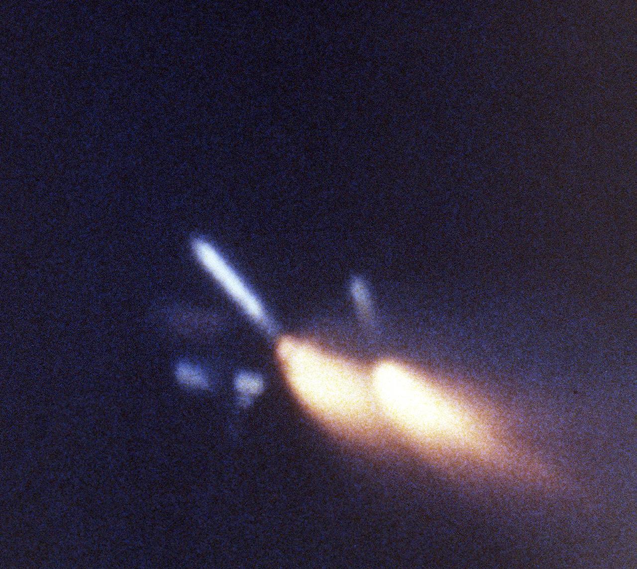 This view, taken by a motion picture tracking camera for the STS-3 mission, shows both left and right solid rocket boosters (SRB's) at the moment of separation from the external tank (ET). After impact to the ocean, they were retrieved and refurbished for reuse. The Shuttle's SRB's and solid rocket motors (SRM's) are the largest ever built and the first designed for refurbishment and reuse. Standing nearly 150-feet high, the twin boosters provide the majority of thrust for the first two minutes of flight, about 5.8 million pounds. That is equivalent to 44 million horsepower, or the combined power of 400,000 subcompact cars.
