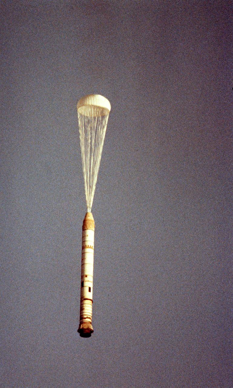 The right solid rocket booster (SRB) for the STS-5 mission, with one chute opened, falls after its separation from the external tank (ET). This view was photographed from a Cast Glance aircraft. After impact to the ocean, it was retrieved and refurbished for reuse. The Shuttle's SRB's and solid rocket motors (SRM's) are the largest ever built and the first designed for refurbishment and reuse. Standing nearly 150-feet high, the twin boosters provide the majority of thrust for the first two minutes of flight, about 5.8 million pounds. That is equivalent to 44 million horsepower, or the combined power of 400,000 subcompact cars.