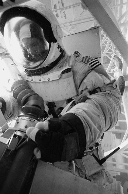 In February 1980, a satellite called Solar Maximum Mission Spacecraft, or Solar Max, was launched into Earth's orbit. Its primary objective was to provide a detailed study of solar flares,active regions on the Sun's surface, sunspots, and other solar activities. Additionally, it was to measure the total output of radiation from the Sun. Not much was known about solar activity at that time except for a slight knowledge of solar flares. After its launch, Solar Max fulfilled everyone's expectations. However, after a year in orbit, Solar Max's Altitude Control System malfunctioned, preventing the precise pointing of instruments at the Sun. NASA scientists were disappointed at the lost data, but not altogether dismayed because Solar Max had been designed for Space Shuttle retrievability, enabling repair to the satellite. On April 6, 1984, Space Shuttle Challenger (STS-41C), Commanded by astronaut Robert L. Crippen and piloted by Francis R. Scobee, launched on a historic voyage. This voyage initiated a series of firsts for NASA; the first satellite retrieval, the first service use of a new space system called the Marned Maneuvering Unit (MMU), the first in-orbit repair, the first use of the Remote Manipulator System (RMS), and the Space Shuttle Challenger's first space flight. The mission was successful in retrieving Solar Max. Mission Specialist Dr. George D. Nelson, using the MMU, left the orbiter's cargo bay and rendezvoused with Solar Max. After attaching himself to the satellite, he awaited the orbiter to maneuver itself nearby. Using the RMS, Solar Max was captured and docked in the cargo bay while Dr. Nelson replaced the altitude control system and the coronagraph/polarimeter electronics box. After the repairs were completed, Solar Max was redeposited in orbit with the assistance of the RMS. Prior to the April 1984 launch, countless man-hours were spent preparing for this mission. The crew of Challenger spent months at Marshall Space Flight Center's (MSFC) Neutral Buoyancy Simulator (NBS) practicing retrieval maneuvers, piloting the MMU, and training on equipment so they could make the needed repairs to Solar Max. Pictured is Dr. Nelson performing a replacement task on the Solar Max mock-up in the NBS.