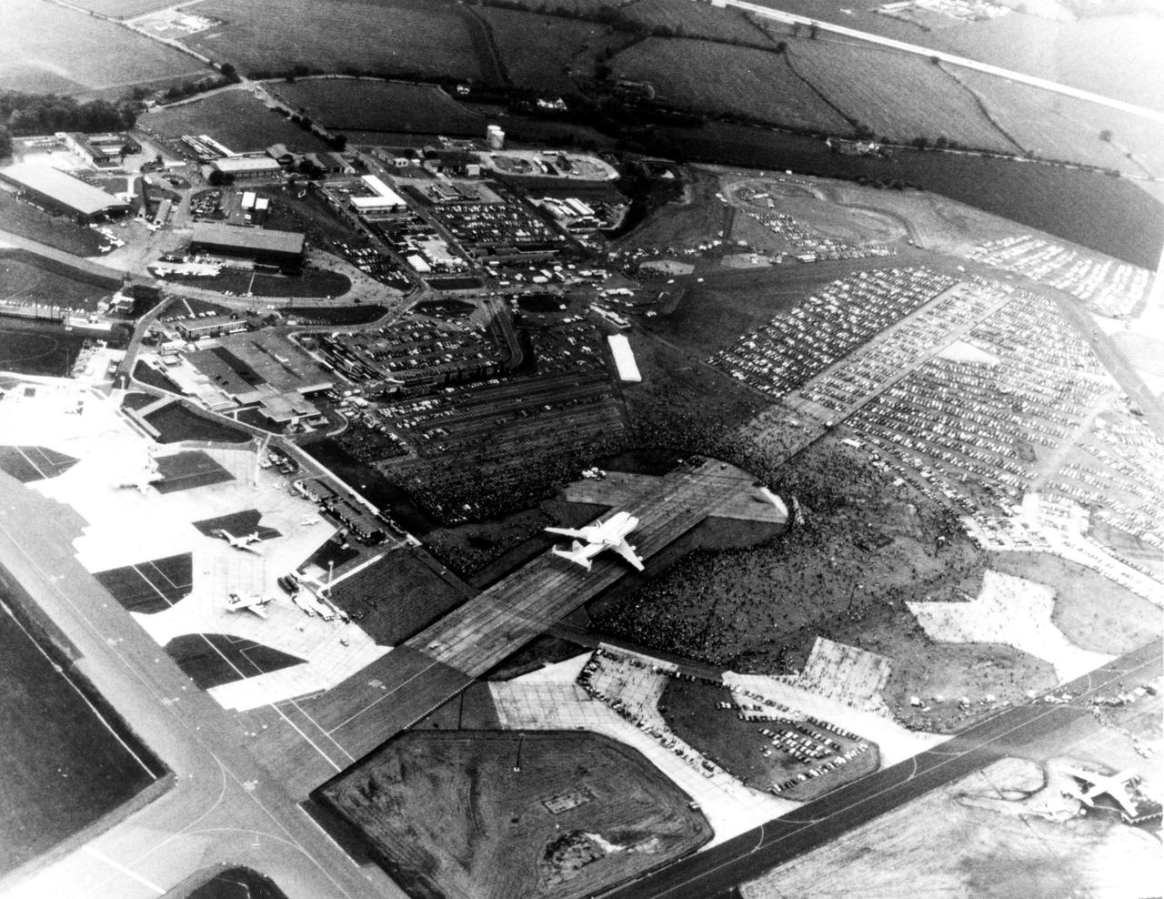 KENNEDY SPACE CENTER, FLA. -- Thousands of Britons surround the Space Shuttle Orbiter Enterprise at Stansted Airport, near London.  The Enterprise atop its 747 carrier aircraft was viewed in London, Bonn-Cologne, West Germany, Rome and Ottawa, Canada, in addition to being shown at the Paris Air Show in June 1983.