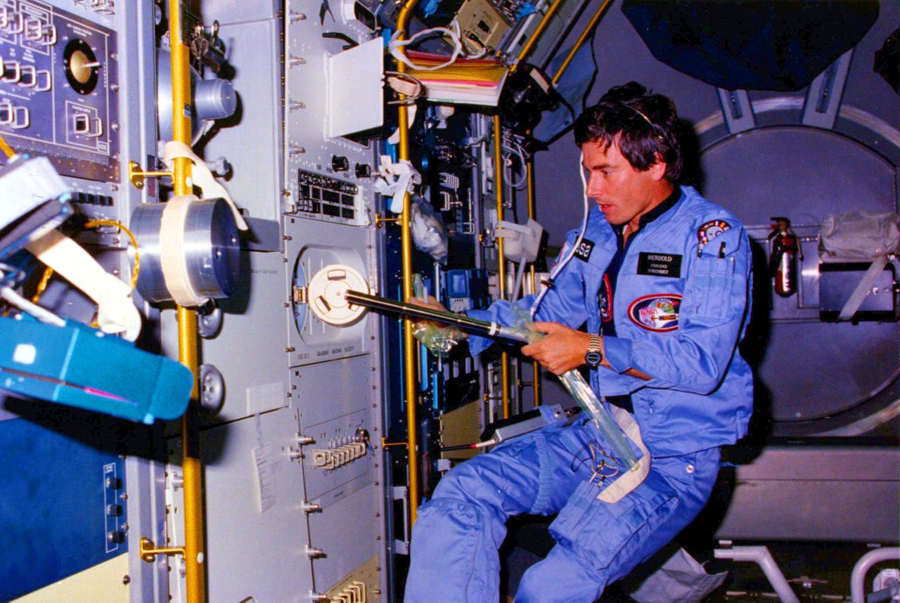 The Space Shuttle was designed to carry large payloads into Earth orbit. One of the most important payloads is Spacelab. The Spacelab serves as a small but well-equipped laboratory in space to perform experiments in zero-gravity and make astronomical observations above the Earth's obscuring atmosphere. In this photograph, Payload Specialist, Ulf Merbold, is working at Gradient Heating Facility on the Materials Science Double Rack (MSDR) inside the science module in the Orbiter Columbia's payload bay during STS-9, Spacelab-1 mission. Spacelab-1, the joint ESA (European Space Agency)/NASA mission, was the first operational flight for the Spacelab, and demonstrated new instruments and methods for conducting experiments that are difficult or impossible in ground-based laboratories. This facility performed, in extremely low gravity, a wide variety of materials processing experiments in crystal growth, fluid physics, and metallurgy. The Marshall Space Flight Center had overall management responsibilities.
