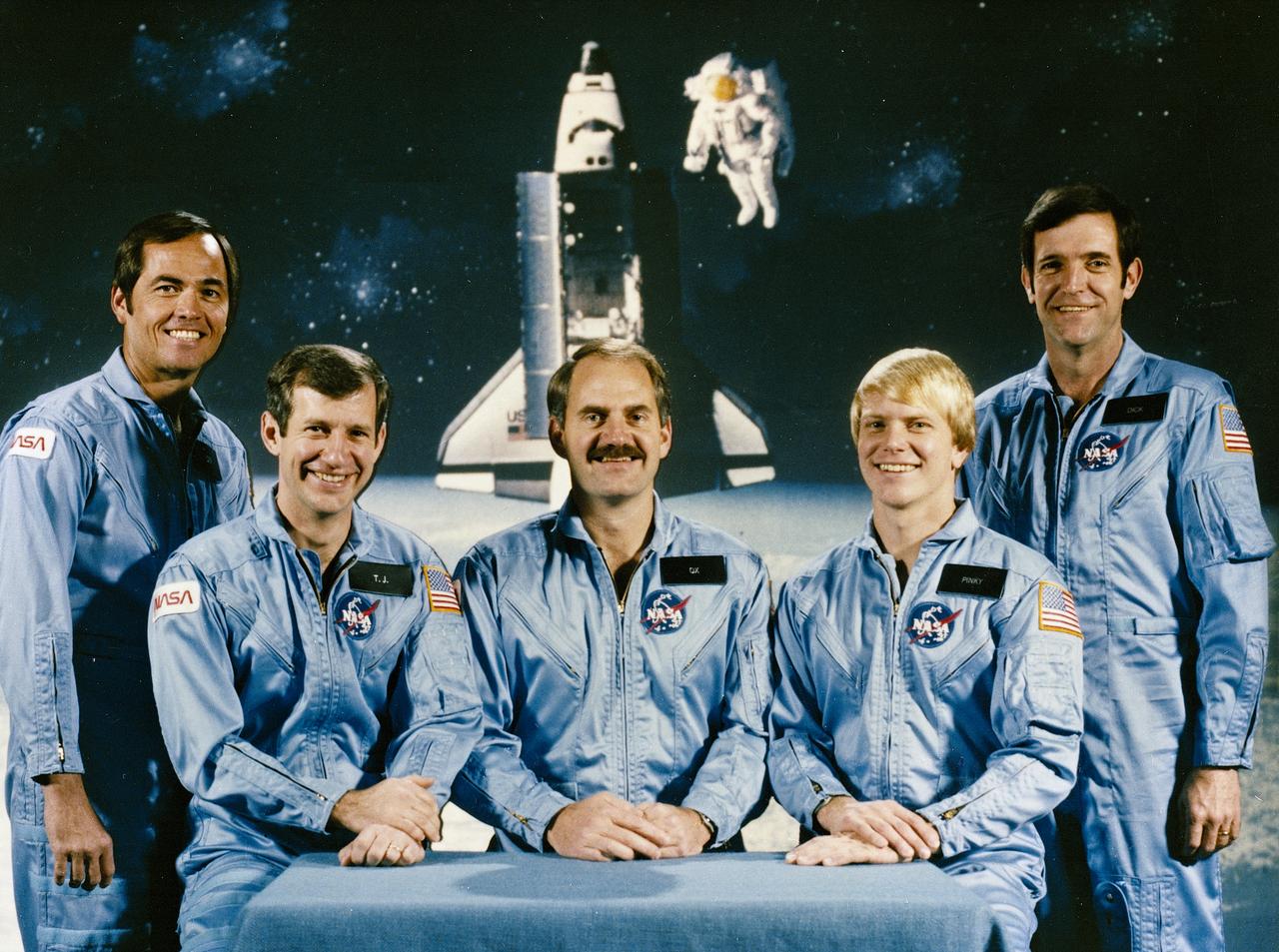 The crew assigned to the STS-41CB (STS-13) mission included (left to right) Robert L. Crippen, commander; Terry J. Hart, mission specialist; James D. Van-Hoften, mission specialist; George D. Nelson, mission specialist; and Francis R. (Dick) Scobee, pilot. Launched aboard the Space Shuttle Challenger on April 6, 1984 at 8:58:00 am (EST), the STS-41C mission marked the first direct ascent trajectory for the Space Shuttle. The crew deployed the Long Duration Exposure Facility (LDEF).