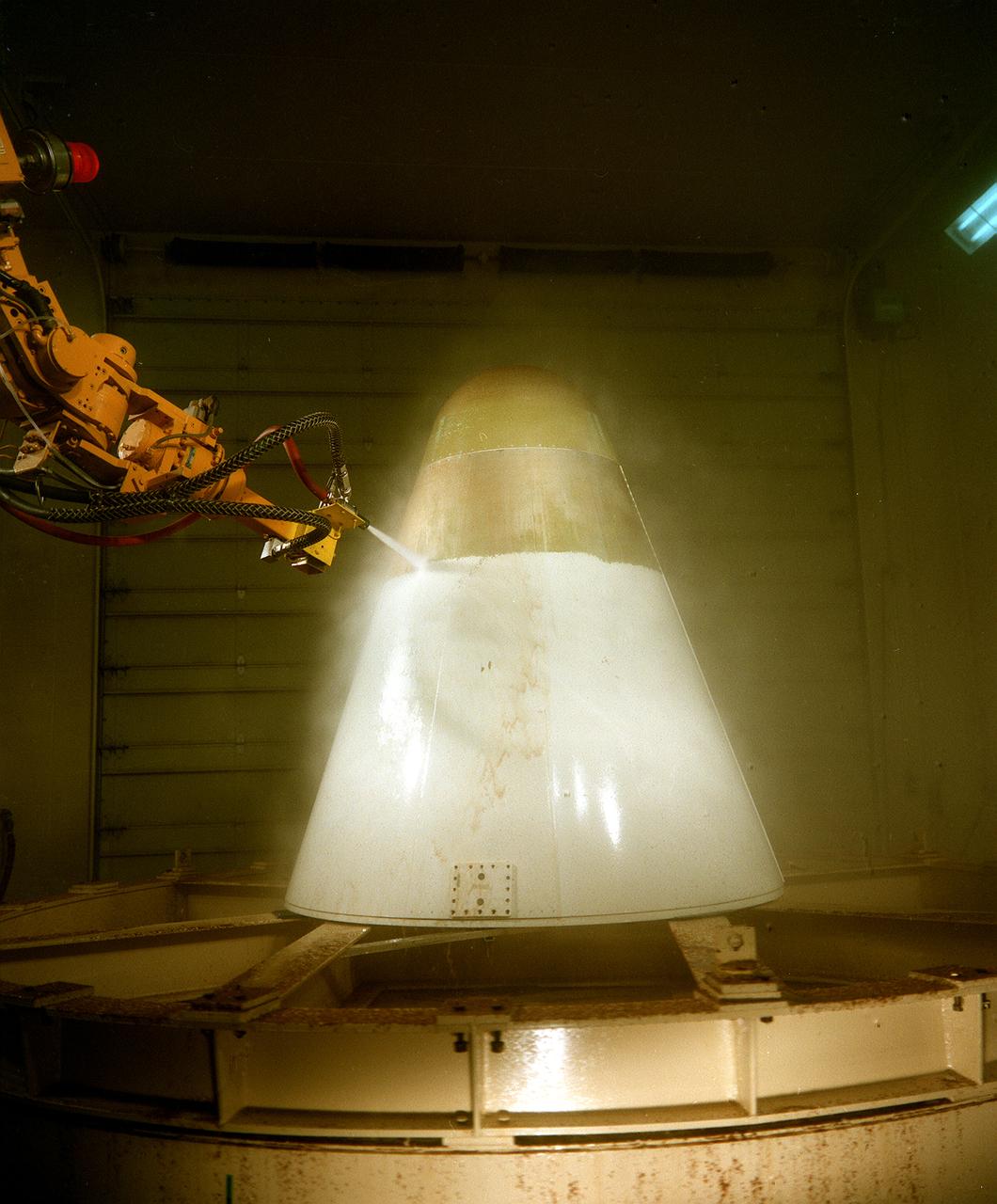 The Waterblast Research Cell supports development of automated systems that remove thermal protection materials and coatings from space flight hardware. These systems remove expended coatings without harsh chemicals or damaging underlying material. Potential applications of this technology include the removal of coatings from industrial machinery, aircraft, and other large structures. Use of the robot improves worker safety by reducing the exposure of persornel to high-pressure water. This technology is a proactive alternative to hazardous chemical strippers.