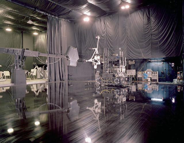 Marshall employees conduct tests on the simulated rendezvous docking mechanism (SRDM)as depicted in this photo of the flat floor area in building 4619.