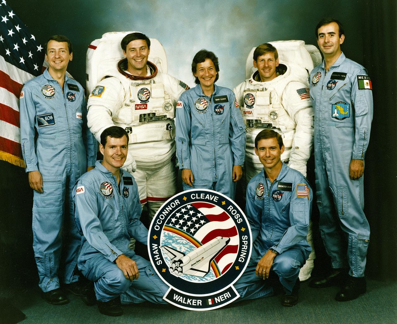 The crew assigned to the STS-61B mission included (kneeling left to right) Bryan D. O’conner, pilot; and Brewster H. Shaw, commander. On the back row, left to right, are Charles D. Walker, payload specialist; mission specialists Jerry L. Ross, Mary L. Cleave, and Sherwood C. Spring; and Rodolpho Neri Vela, payload specialist. Launched aboard the Space Shuttle Atlantis November 28, 1985 at 7:29:00 pm (EST), the STS-61B mission’s primary payload included three communications satellites: MORELOS-B (Mexico); AUSSAT-2 (Autralia); and SATCOM KU-2 (RCA Americom. Two experiments were conducted to test assembling erectable structures in space: EASE (Experimental Assembly of Structures in Extravehicular Activity), and ACCESS (Assembly Concept for Construction of Erectable Space Structure). In a joint venture between NASA/Langley Research Center in Hampton, VA and Marshall Space Flight Center (MSFC), the Assembly Concept for Construction of Erectable Space Structures (ACCESS) was developed and demonstrated at MSFC's Neutral Buoyancy Simulator (NBS). The primary objective of this experiment was to test the ACCESS structural assembly concept for suitability as the framework for larger space structures and to identify ways to improve the productivity of space construction.