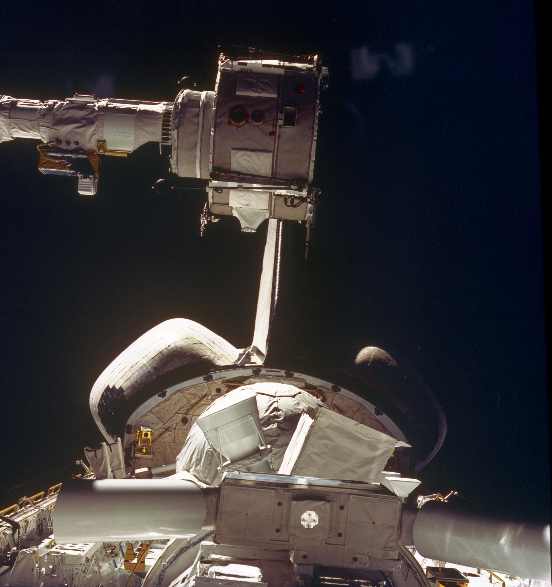View of the Spacelab 2 package in Challenger's payload bay with the RMS positioned nearby