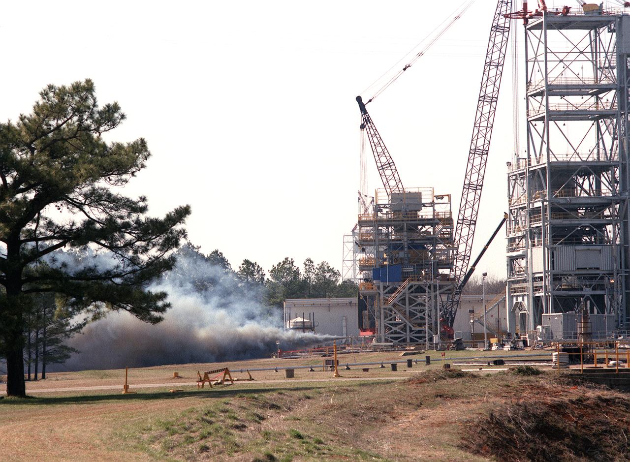 The Marshall Space Flight Center (MSFC) successfully test fired the third in a series of Transient Pressure Test Articles (TPTA) in its east test area. The test article was a short-stack solid rocket motor 52-feet long and 12-feet in diameter. The TPTA tests were designed to evaluate the effects of temperature, pressure and external loads encountered by the SRM, primarily during ignition transients. Instrumentation on the motor recorded approximately 1,000 charnels of data to verify the structural performance, thermal response, sealing capability of the redesign field, and case-to-nozzle joints. The TPTA test stand, 14-feet wide by 26-feet long by 33-feet high, was built in 1987. The TPTA series was a joint effort among Morton Thiokol, Inc., United Space Boosters, Inc., Wyle Laboratories, and MSFC. Wyle Laboratories conducted the tests for the MSFC, which manages the redesigned SRM program for NASA.