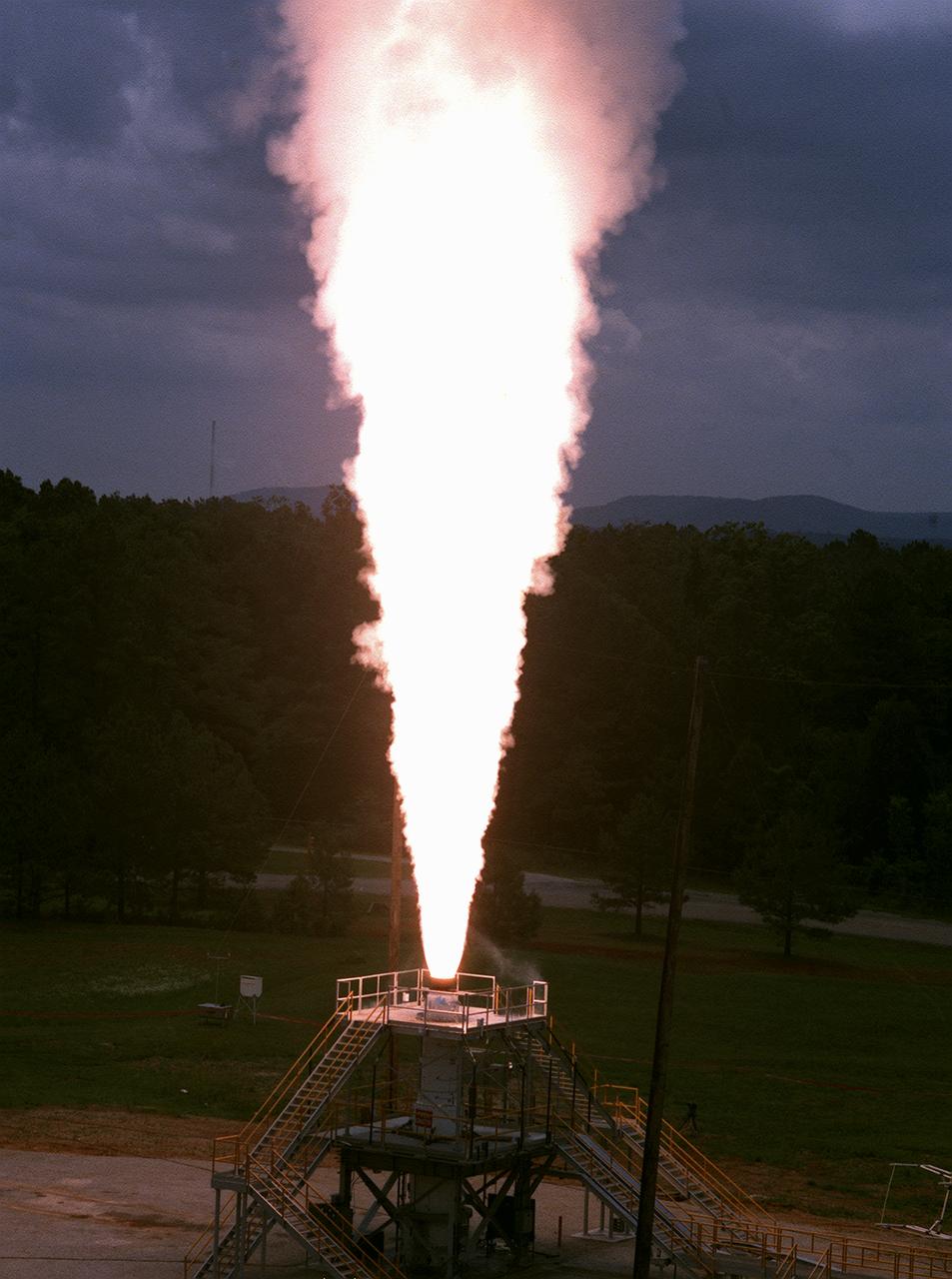 The Marshall Space Flight Center (MSFC) engineers test fired a 26-foot long, 100,000-pound-thrust solid rocket motor for 30 seconds at the MSFC east test area, the first test firing of the Modified NASA Motor (M-NASA Motor). The M-NASA Motor was fired in a newly constructed stand. The motor is 48-inches in diameter and was loaded with two propellant cartridges weighing a total of approximately 12,000 pounds. The purpose of the test was to learn more about solid rocket motor insulation and nozzle materials and to provide young engineers additional hands-on expertise in solid rocket motor technology. The test is a part of NASA's Solid Propulsion Integrity Program, that is to provide NASA engineers with the techniques, engineering tools, and computer programs to be able to better design, build, and verify solid rocket motors.