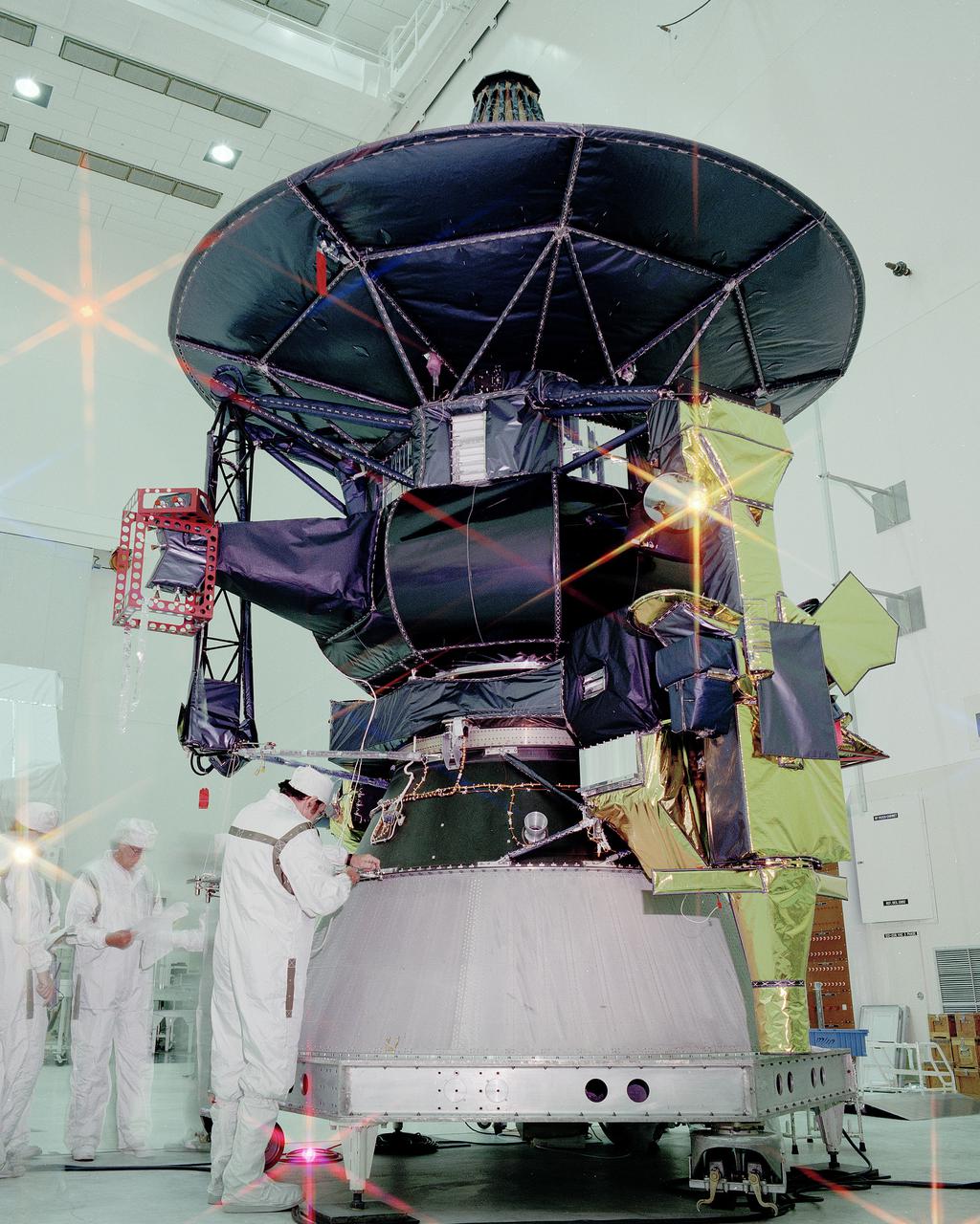 CAPE CANAVERAL, Fla. -- At the Kennedy Space Center’s SAEF-2 planetary spacecraft checkout facility, technicians work on the spacecraft Galileo prior to moving it to the Vertical Processing Facility for mating with an Inertial Upper Stage. Galileo is scheduled to be launched aboard Atlantis on space shuttle mission STS-34, Oct. 12, 1989 and sent to the planet Jupiter, a journey which will take more than six years to complete. In December 1995, as the two and one half ton spacecraft orbits Jupiter with its 10 scientific instruments, a probe will be released to parachute into the Jovian atmosphere. Photo Credit: NASA