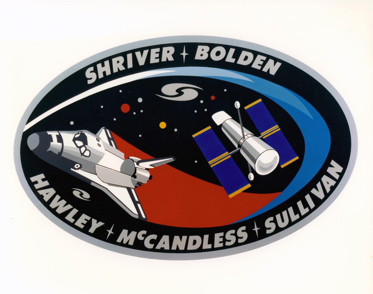 JOHNSON SPACE CENTER, HOUSTON, TEXAS -- STS-31 CREW PATCH – The mission insignia for NASA’s STS-31 mission features the Hubble Space Telescope (HST) in its observing configuration against a background of the universe it will study.  The cosmos includes a stylistic depiction of galaxies in recognition of the contribution made by Sir Edwin Hubble to our understanding of the nature of galaxies and the expansion of the universe.  The STS-31 crew points out that it is in honor of Hubble’s work “that this great observatory in space bears his name.”  The depicted Space Shuttle trails a spectrum symbolic of both the red shift observations that were so important to Hubble’s work and now information which will be obtained with the HST.  Encircling the art work, designed by the crew, are the names of its members: Loren J. Shriver, mission commander; Charles F. Bolden, pilot; and Steven A. Hawley, Bruce McCandless II and Kathryn D. Sullivan, mission specialists.  The NASA insignia design for Shuttle flights is reserved for use by the astronauts and for other official use as the NASA Administrator may authorize.  Public availability has been approved only in the form of illustrations by the various news media. When and if there is any change in this policy, which is not anticipated, it will be publicly announced.
