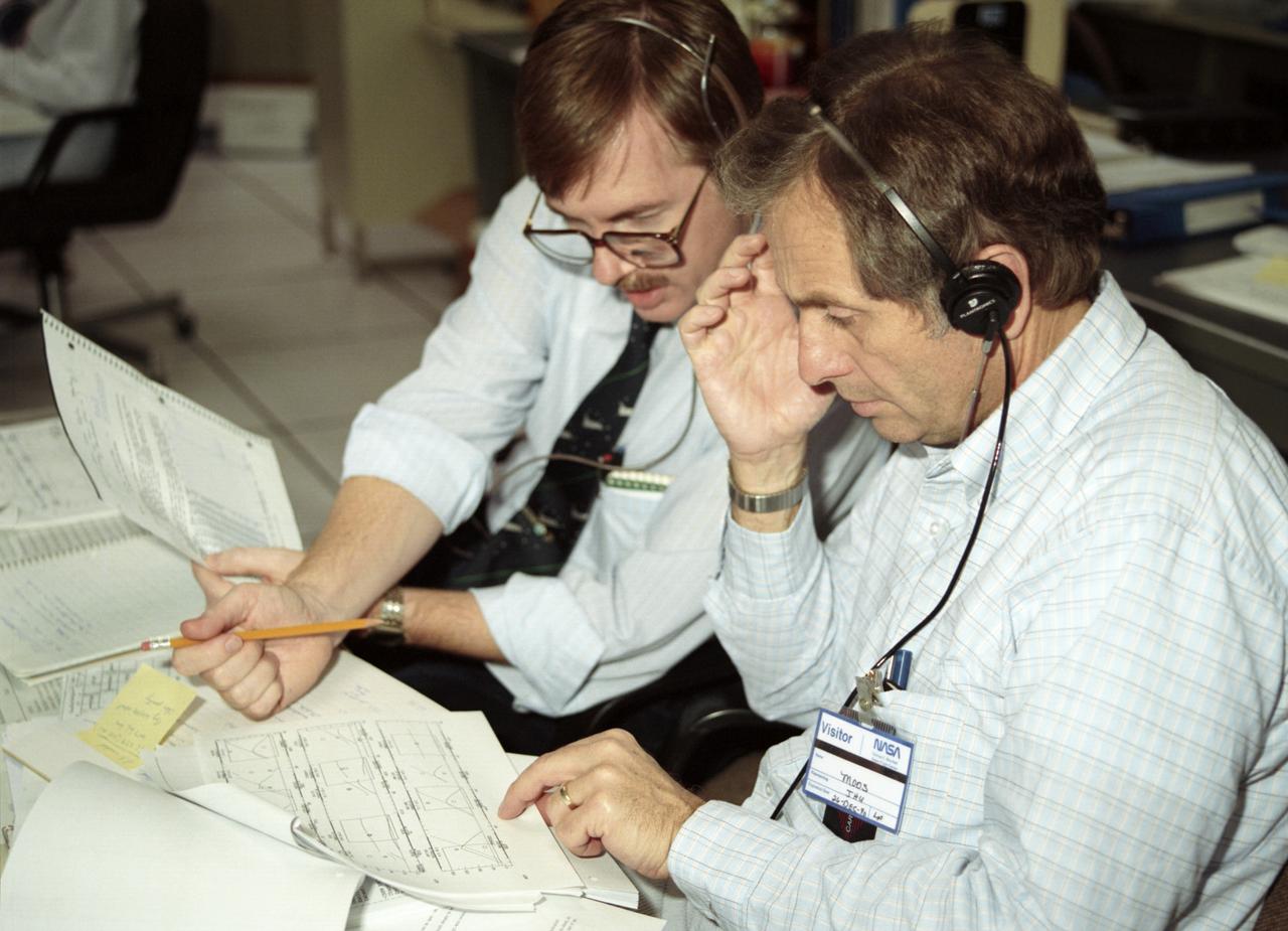 The primary objective of the STS-35 mission was round the clock observation of the celestial sphere in ultraviolet and X-Ray astronomy with the Astro-1 observatory which consisted of four telescopes: the Hopkins Ultraviolet Telescope (HUT); the Wisconsin Ultraviolet Photo-Polarimeter Experiment (WUPPE); the Ultraviolet Imaging Telescope (UIT); and the Broad Band X-Ray Telescope (BBXRT). The Huntsville Operations Support Center (HOSC) Spacelab Payload Operations Control Center (SL POCC) at the Marshall Space Flight Center (MSFC) was the air/ground communication channel used between the astronauts and ground control teams during the Spacelab missions. Teams of controllers and researchers directed on-orbit science operations, sent commands to the spacecraft, received data from experiments aboard the Space Shuttle, adjusted mission schedules to take advantage of unexpected science opportunities or unexpected results, and worked with crew members to resolve problems with their experiments. Due to loss of data used for pointing and operating the ultraviolet telescopes, MSFC ground teams were forced to aim the telescopes with fine tuning by the flight crew. This photo captures the activity of viewing HUT data in the Mission Manager Actions Room during the mission. 