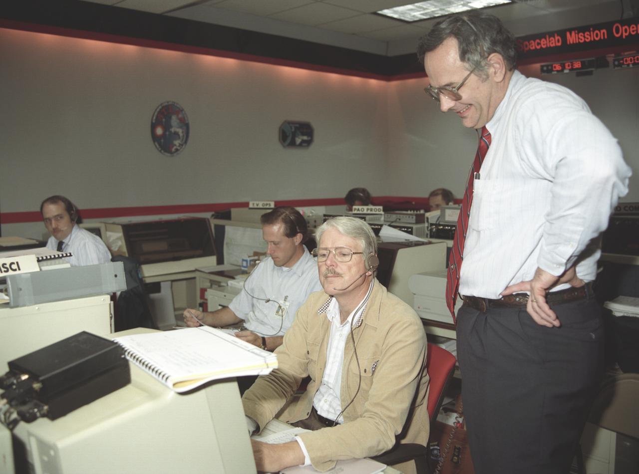 The primary objective of the STS-35 mission was round the clock observation of the celestial sphere in ultraviolet and X-Ray astronomy with the Astro-1 observatory which consisted of four telescopes: the Hopkins Ultraviolet Telescope (HUT); the Wisconsin Ultraviolet Photo-Polarimeter Experiment (WUPPE); the Ultraviolet Imaging Telescope (UIT); and the Broad Band X-Ray Telescope (BBXRT). The Huntsville Operations Support Center (HOSC) Spacelab Payload Operations Control Center (SL POCC) at the Marshall Space Flight Center (MSFC) was the air/ground communication channel used between the astronauts and ground control teams during the Spacelab missions. Teams of controllers and researchers directed on-orbit science operations, sent commands to the spacecraft, received data from experiments aboard the Space Shuttle, adjusted mission schedules to take advantage of unexpected science opportunities or unexpected results, and worked with crew members to resolve problems with their experiments.  Due to loss of data used for pointing and operating the ultraviolet telescopes, MSFC ground teams were forced to aim the telescopes with fine tuning by the flight crew. This photo captures the activity of WUPPE data review at the Science Operations Area during the mission. 