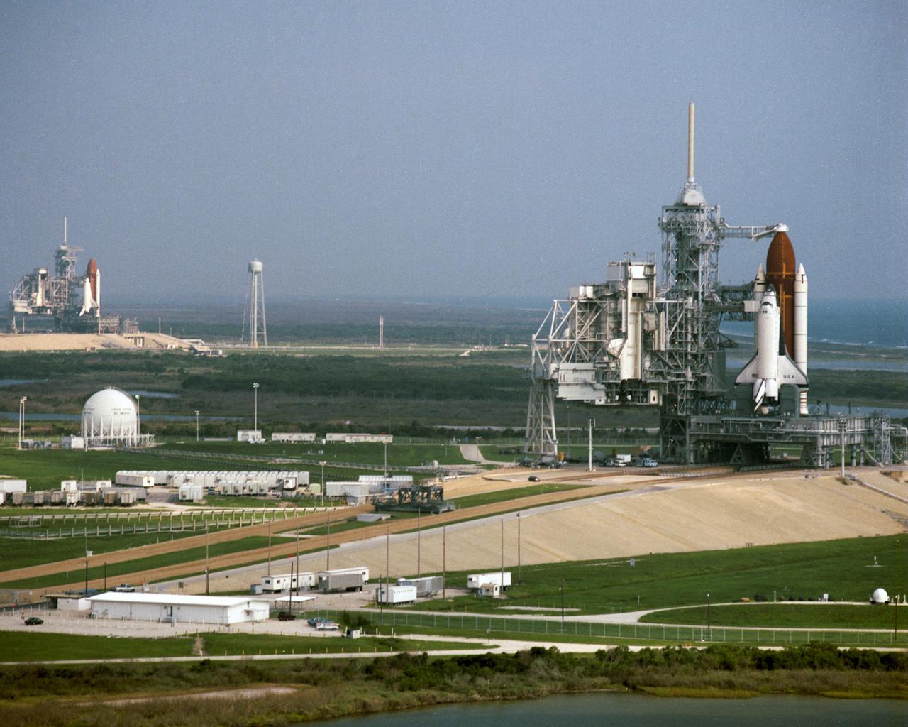 CAPE CANAVERAL, Fla. -  This rare view on September 5 shows on adjacent Launch Complex 39 pads with the Rotating Service Structures retracted. The orbiter Columbia on Pad A [foreground] was being readied for a September 6 early morning launch on Mission STS-39, while it sister spaceship, the orbiter Discovery, was set to begin preparations for an October liftoff on Mission STS- 41.