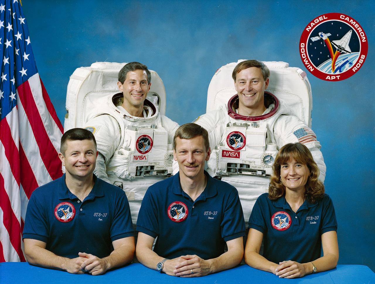 This is the STS-37 Crew portrait. Pictured from left to right are Kenneth D. (Ken) Cameron, pilot; Jay Apt, mission specialist; Steven R. Nagel, commander; and Jerry L. Ross and Linda M. Godwin, mission specialists.  Launched aboard the Space Shuttle Atlantis on April 5, 1991 at 9:22:44am (EST), the crew’s major objective was the deployment of the Gamma Ray Observatory (GRO).  Included in the observatory were the Burst and Transient Source Experiment (BATSE); the Imaging Compton Telescope (COMPTEL); the Energetic Gamma Ray Experiment Telescope (EGRET); and the Oriented Scintillation Spectrometer Telescope (OSSEE).