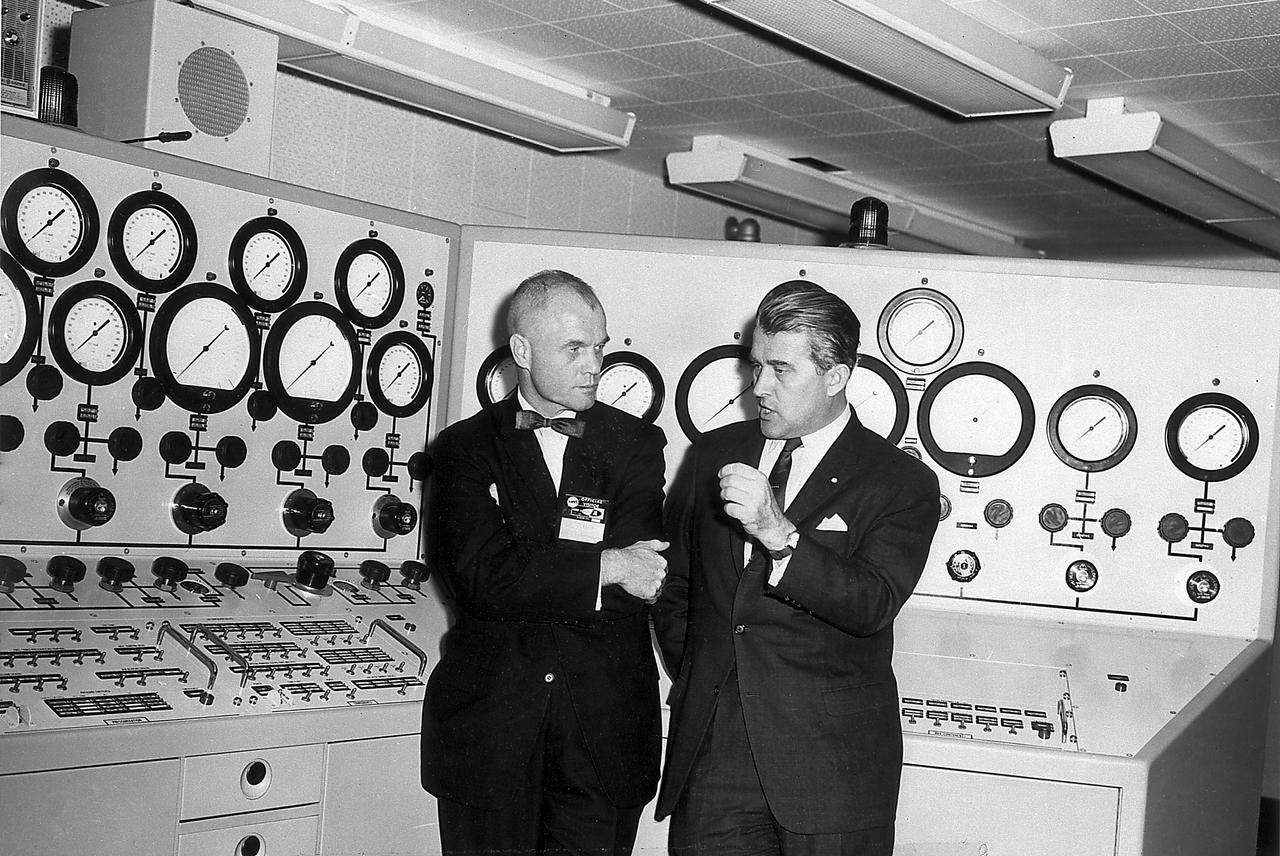 Dr. von Braun briefs Astronaut John Glenn in the control room of the Vehicle Test Section, Quality Assurance Division, Marshall Space Flight Center (MSFC), November 28, 1962.