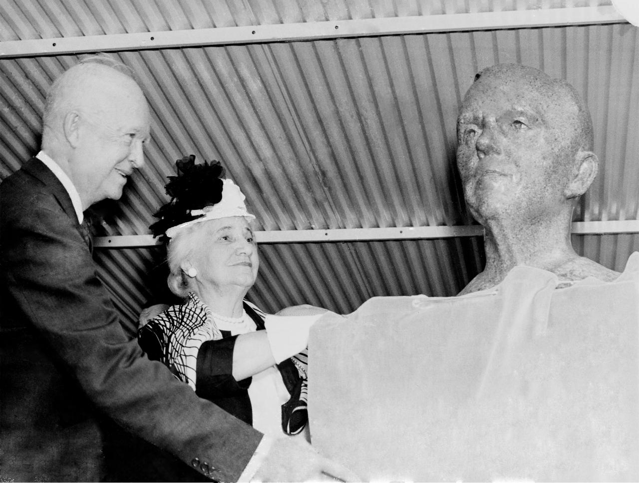 President Dwight D. Eisenhower and Mrs. George C. Marshall unveil the bronze bust of General George C. Marshall during the dedication of the Marshall Space Flight Center. Eisenhower signed an Executive Order on October 21, 1959 directing the transfer of persornel from the Redstone Arsenal's Army Ballistic Missile Agency Development Operations Division to NASA. On March 15, 1960, another Executive Order announced that the space complex formed within the boundaries of Redstone Arsenal would become the George C. Marshall Space Flight Center. The Center was activated on July 1, 1960, with dedication ceremonies taking place September 8, 1960.