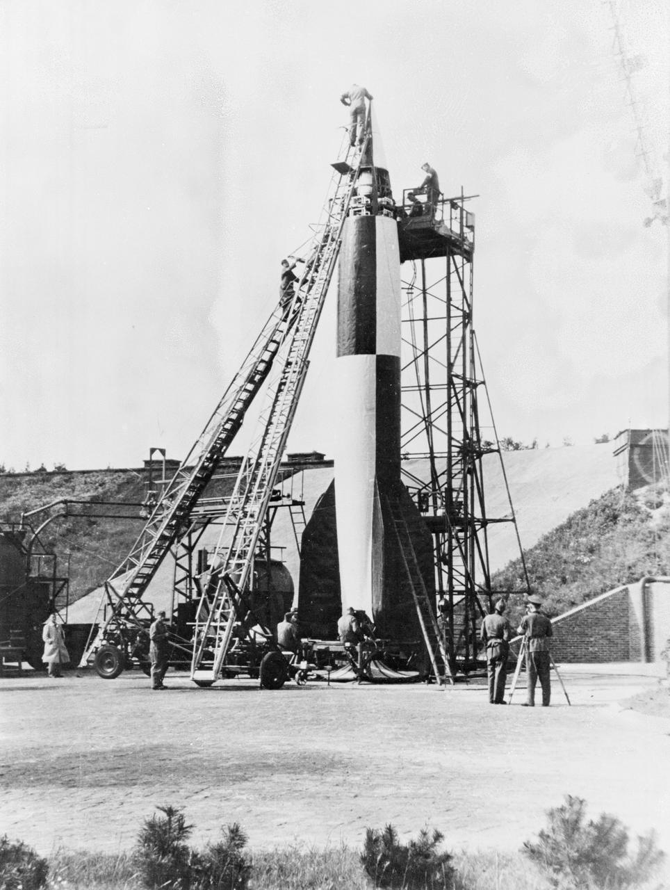 German technicians stack the various stages of the V-2 rocket in this undated photograph. The team of German engineers and scientists who developed the V-2 came to the United States at the end of World War II and worked for the U. S. Army at Fort Bliss, Texas, and Redstone Arsenal in Huntsville, Alabama.