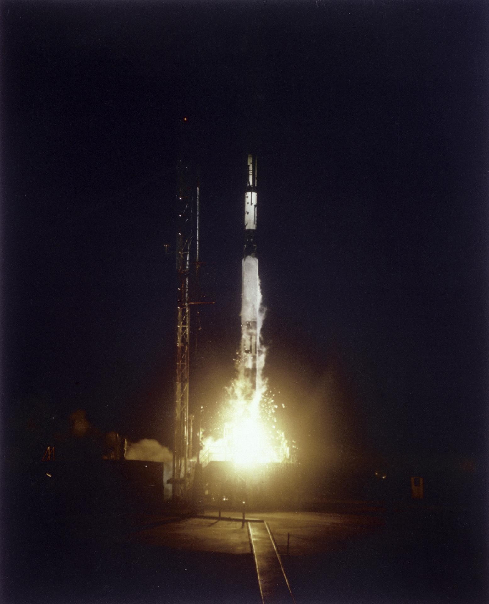 The SLV-7 rocket lifts off from the launch pad at night carrying the Vanguard III satellite.