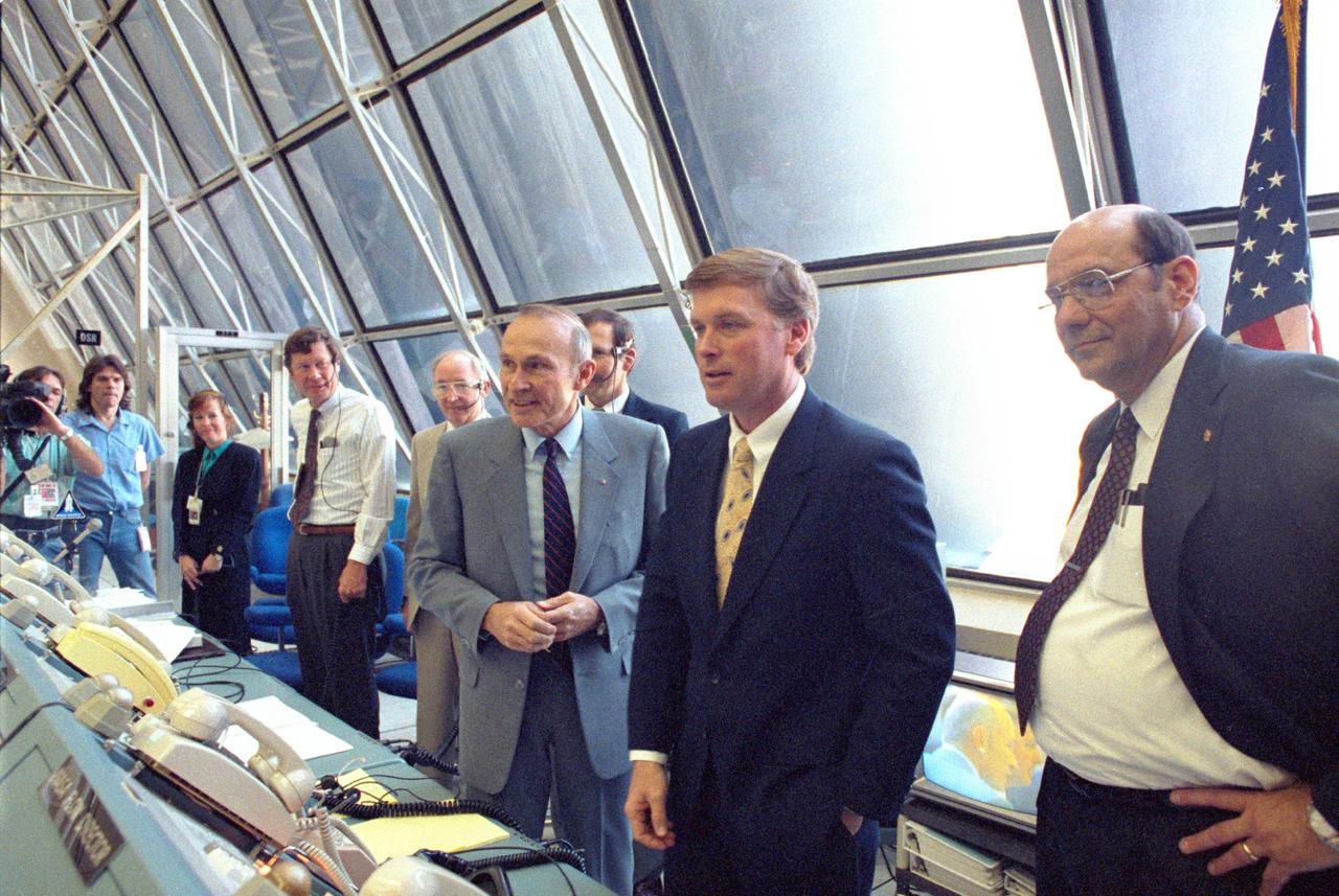 KENNEDY SPACE CENTER, FLA. --  Vice President Dan Quayle [second from right] is briefed on firing room activities during the Terminal Countdown Demonstration Test.  Explaining the launch team's role are Launch Director Robert Sieck (left of Quayle) and NASA Deputy Administrator J.R. Thompson (right).  Quayle spoke with the STS-39 flight crew and met launch team members, toured Center facilities, gave a speech, and held a press conference.