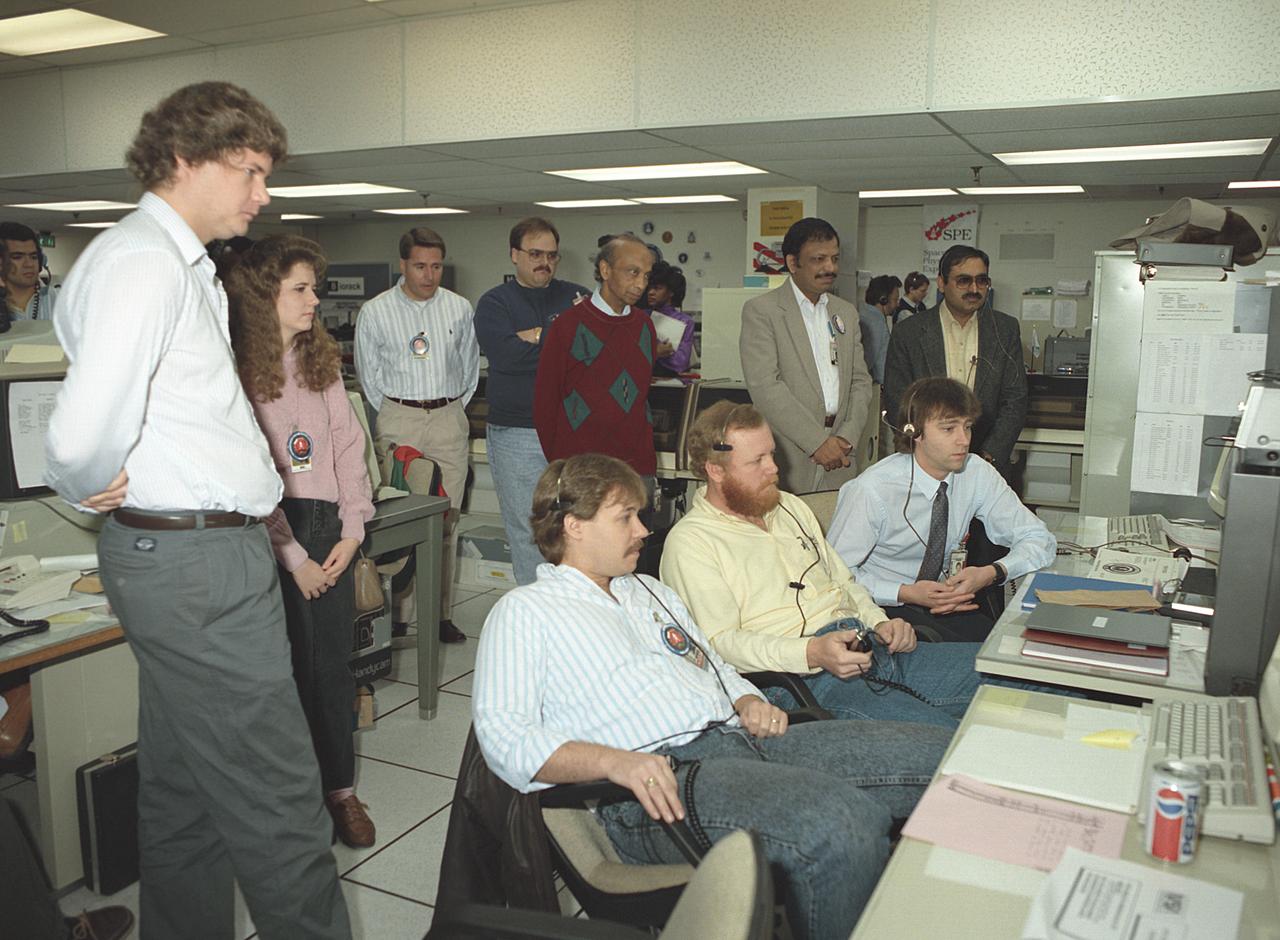 The primary payload for Space Shuttle Mission STS-42, launched January 22, 1992, was the International Microgravity Laboratory-1 (IML-1), a pressurized manned Spacelab module. The goal of IML-1 was to explore in depth the complex effects of weightlessness of living organisms and materials processing. Around-the-clock research was performed on the human nervous system's adaptation to low gravity and effects of microgravity on other life forms such as shrimp eggs, lentil seedlings, fruit fly eggs, and bacteria. Materials processing experiments were also conducted, including crystal growth from a variety of substances such as enzymes, mercury iodide, and a virus. The Huntsville Operations Support Center (HOSC) Spacelab Payload Operations Control Center (SL POCC) at the Marshall Space Flight Center (MSFC) was the air/ground communication channel used between the astronauts and ground control teams during the Spacelab missions. Featured is the Crystal Growth team in the SL POCC during STS-42, IML-1 mission.   