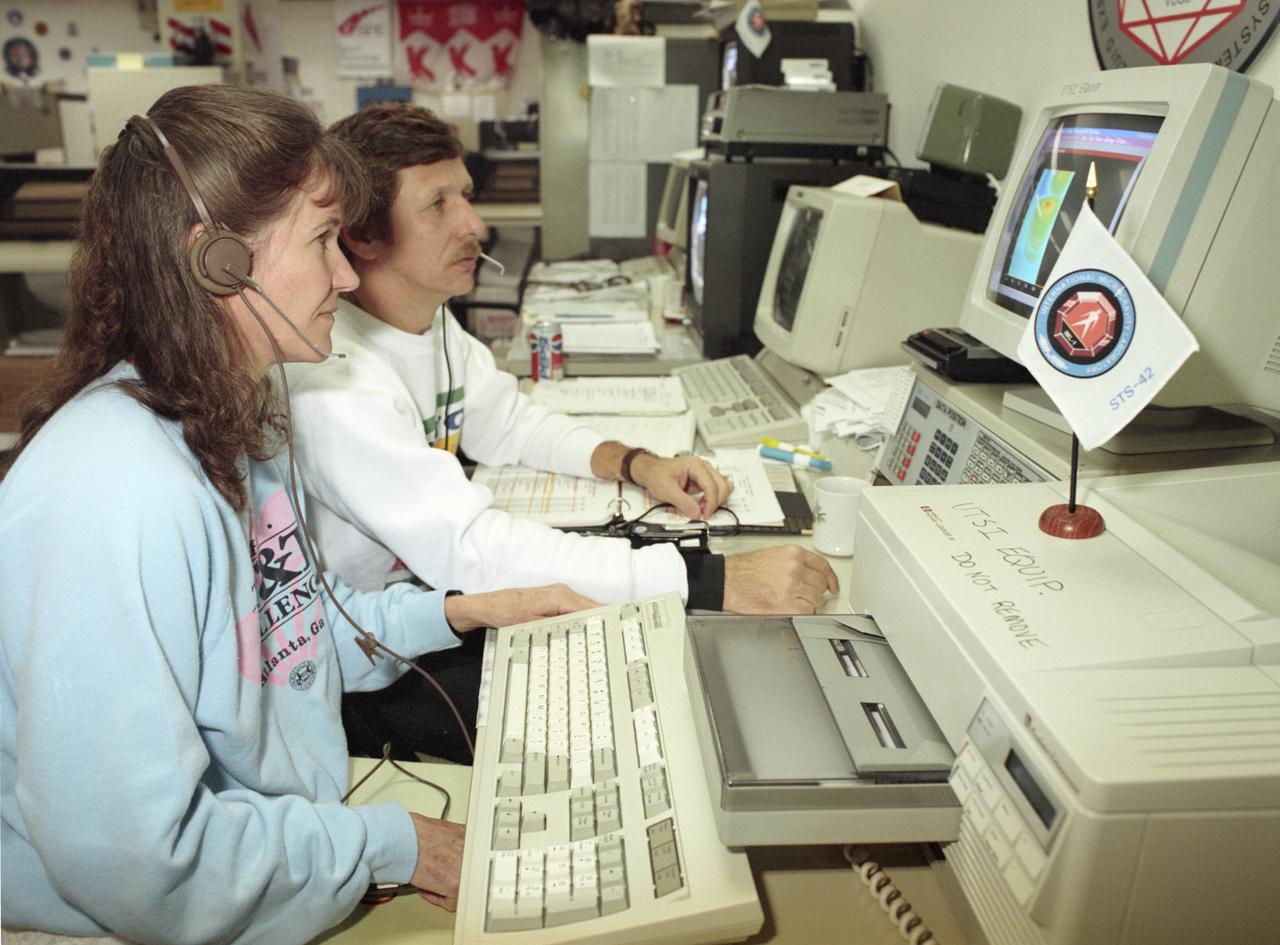 The primary payload for Space Shuttle Mission STS-42, launched January 22, 1992, was the International Microgravity Laboratory-1 (IML-1), a pressurized manned Spacelab module. The goal of IML-1 was to explore in depth the complex effects of weightlessness of living organisms and materials processing. Around-the-clock research was performed on the human nervous system's adaptation to low gravity and effects of microgravity on other life forms such as shrimp eggs, lentil seedlings, fruit fly eggs, and bacteria. Materials processing experiments were also conducted, including crystal growth from a variety of substances such as enzymes, mercury iodide, and a virus. The Huntsville Operations Support Center (HOSC) Spacelab Payload Operations Control Center (SL POCC) at the Marshall Space Flight Center (MSFC) was the air/ground communication channel used between the astronauts and ground control teams during the Spacelab missions. Featured are activities in the SL POCC during STS-42, IML-1 mission.  