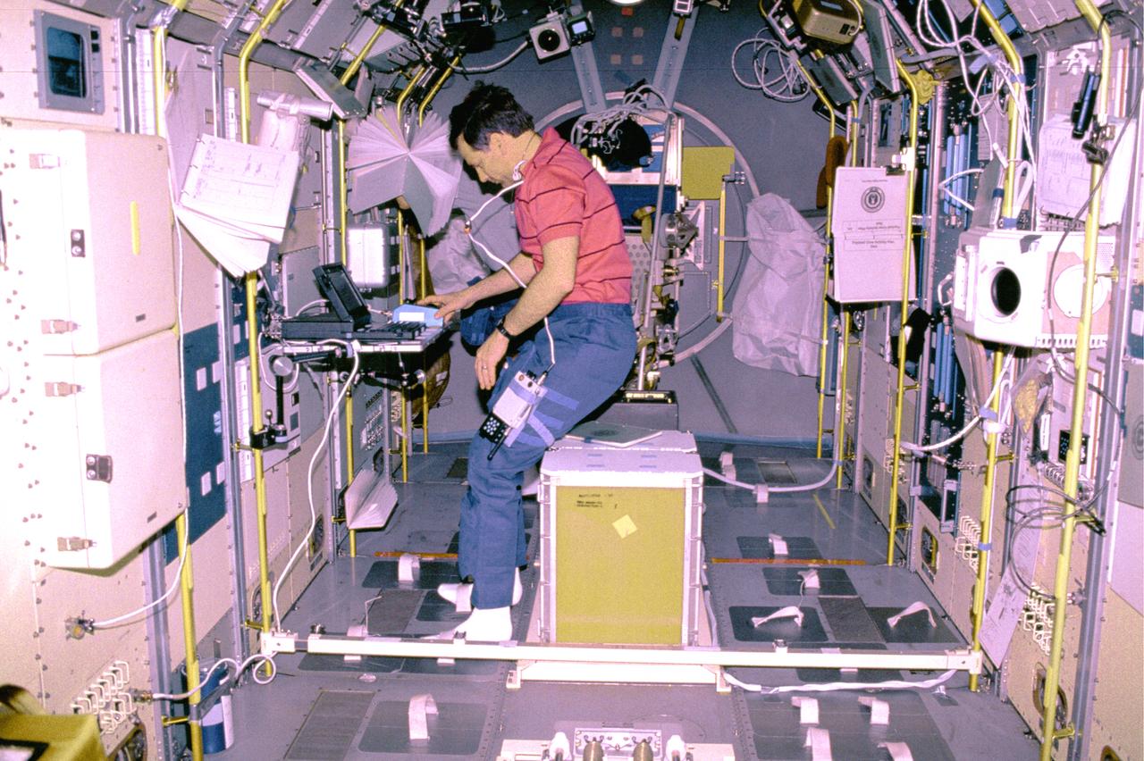 The IML-1 mission was the first in a series of Shuttle flights dedicated to fundamental materials and life sciences research with the international partners. The participating space agencies included: NASA, the 14-nation European Space Agency (ESA), the Canadian Space Agency (CSA), the French National Center of Space Studies (CNES), the German Space Agency and the German Aerospace Research Establishment (DAR/DLR), and the National Space Development Agency of Japan (NASDA). Dedicated to the study of life and materials sciences in microgravity, the IML missions explored how life forms adapt to weightlessness and investigated how materials behave when processed in space. Both life and materials sciences benefited from the extended periods of microgravity available inside the Spacelab science module in the cargo bay of the Space Shuttle Orbiter. In this photograph, Commander Ronald J. Grabe works with the Mental Workload and Performance Evaluation Experiment (MWPE) in the IML-1 module. This experiment was designed as a result of difficulty experienced by crewmembers working at a computer station on a previous Space Shuttle mission. The problem was due to the workstation's design being based on Earthbound conditions with the operator in a typical one-G standing position. Information gained from this experiment was used to design workstations for future Spacelab missions and the International Space Station. Managed by the Marshall Space Flight Center, IML-1 was launched on January 22, 1992 aboard the Space Shuttle Orbiter Discovery (STS-42 mission).