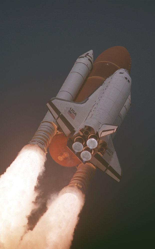 The Space Shuttle Atlantis (STS-45) roars into space in this photo showing a close-up of the Solid Rocket Boosters (SRBs) and the external tank. Atlantis' mission included experiments on the Atmospheric Lab for Applications and Sciences (ATLAS). ATLAS-1 measures long-term variability in the total energy radiated by the sun and determines the variability in the solar spectrum.