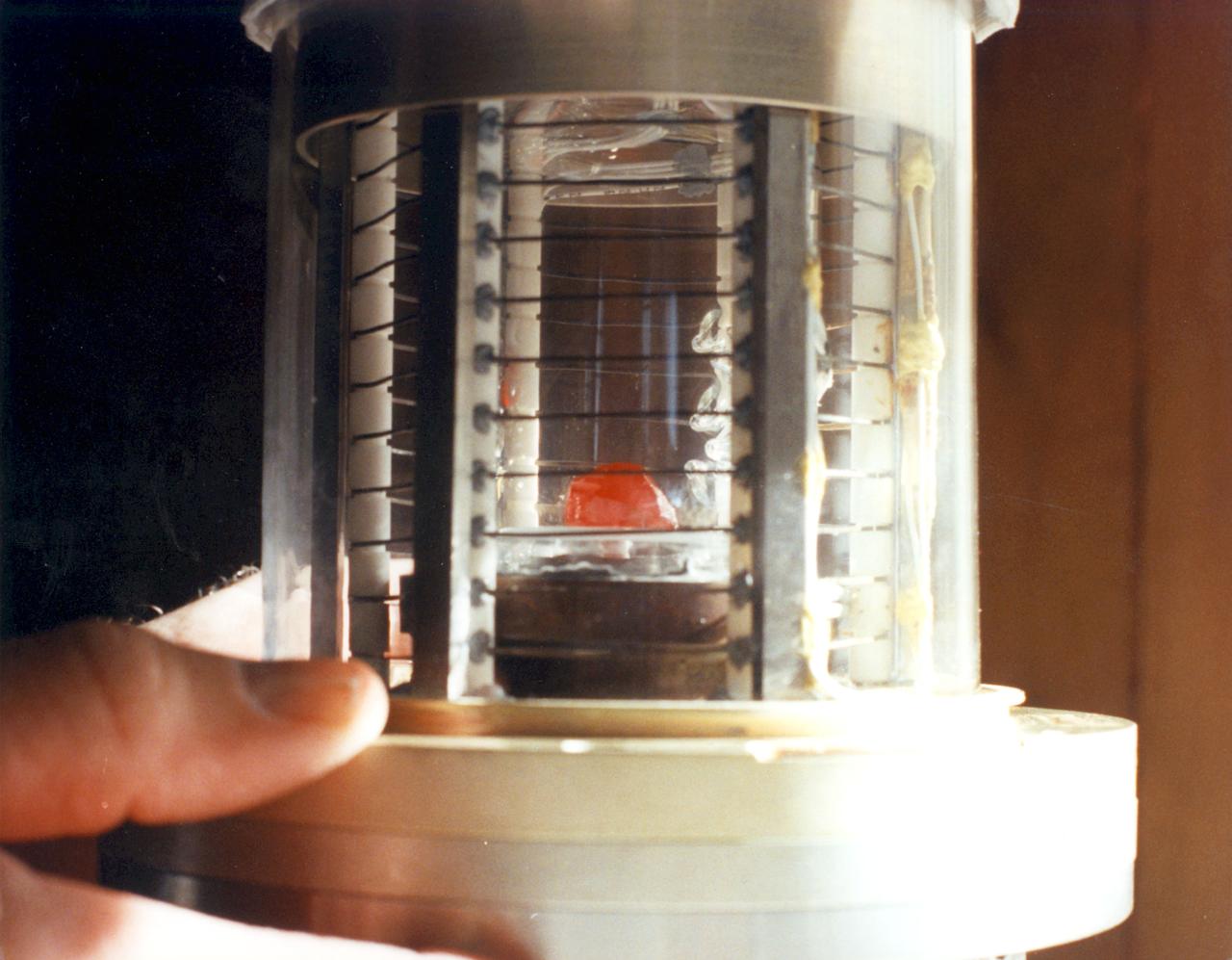 Ampoule view of the Vapor Crystal Growth System (VCGS) Furnace. Used on IML-1 International Microgravity Laboratory Spacelab 3. Prinicipal Investigator and Payload Specialist was Lodewijk van den Berg.