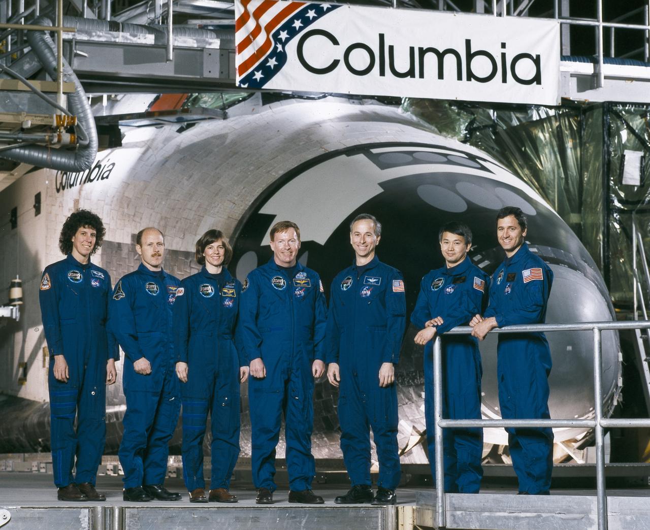 The STS-50 crew portrait includes (from left to right): Ellen S. Baker, mission specialist; Kenneth D. Bowersox, pilot; Bonnie J. Dunbar, payload commander; Richard N. Richards,  commander; Carl J. Meade, mission specialist; Eugene H. Trinh, payload specialist; and Lawrence J. DeLucas, payload specialist. Launched aboard the Space Shuttle Columbia on June 25, 1992 at 12:12:23 pm (EDT), the primary payload for the mission was the U.S. Microgravity Laboratory-1 (USML-1) featuring a pressurized Spacelab module.  
