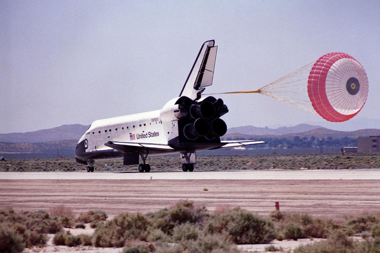 STS-49 Orbiter Endeavour landed at Edwards Air Force Base on May 16, 1992 The drogue chute precedes the main chute in NASA’s first exercise of its detailed test objective on the drag chute system. STS-49 ended its successful nine day mission dedicated to the retrieval, repair, and redeployment of the the INTELSAT VI (F-3) satellite. The communication satellite for the International Telecommunication Satellite organization had been stranded in an unusable orbit since its launch aboard the Titan rocket in March 1990. The mission marked the first time 3 astronauts worked simultaneously outside the space craft.