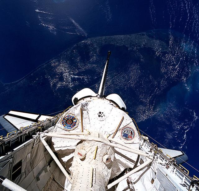 Space Shuttle Columbia (STS-50) onboard photo of the United States Microgravity Laboratory (USML-1) module in payload bay in this scene over the southern two-thirds of the Florida peninsula. Kennedy Space Center (KSC) can be seen just above Columbia's starboard wing.