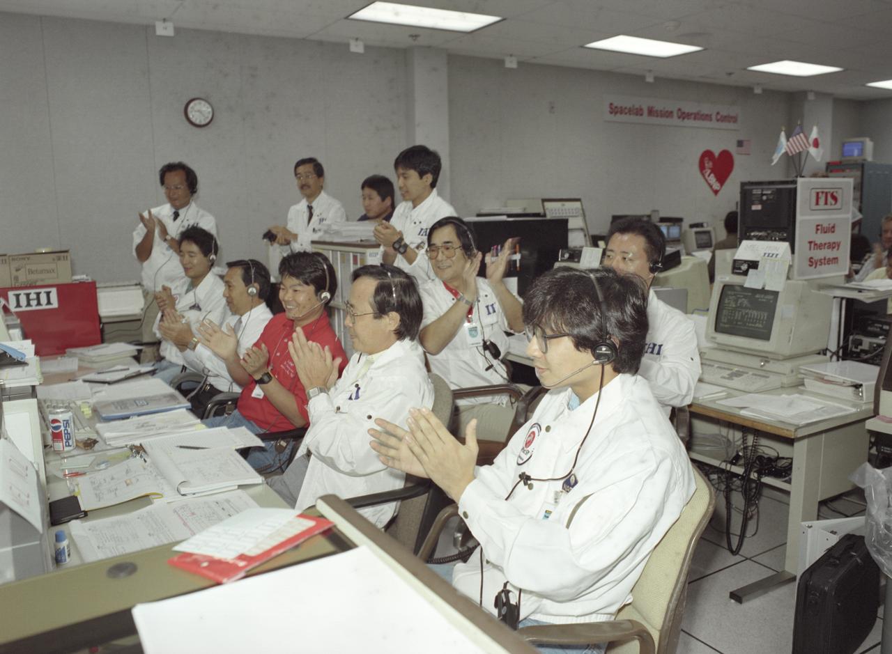 The science laboratory, Spacelab-J (SL-J), flown aboard the STS-47 flight was a joint venture between NASA and the National Space Development Agency of Japan (NASDA) utilizing a manned Spacelab module. The mission conducted 24 materials science and 20 life science experiments, of which 35 were sponsored by NASDA, 7 by NASA, and two collaborative efforts. Materials science investigations covered such fields as biotechnology, electronic materials, fluid dynamics and transport phenomena, glasses and ceramics, metals and alloys, and acceleration measurements. Life sciences included experiments on human health, cell separation and biology, developmental biology, animal and human physiology and behavior, space radiation, and biological rhythms. Test subjects included the crew, Japanese koi fish (carp), cultured animal and plant cells, chicken embryos, fruit flies, fungi and plant seeds, and frogs and frog eggs. Featured together in the Science Operation Area (SOA) are payload specialists’ first Materials Processing Test during NASA/NASDA joint ground activities at the Huntsville Operations Support Center (HOSC) Spacelab Payload Operations Control Center (SL POCC) at Marshall Space Flight Center (MSFC).