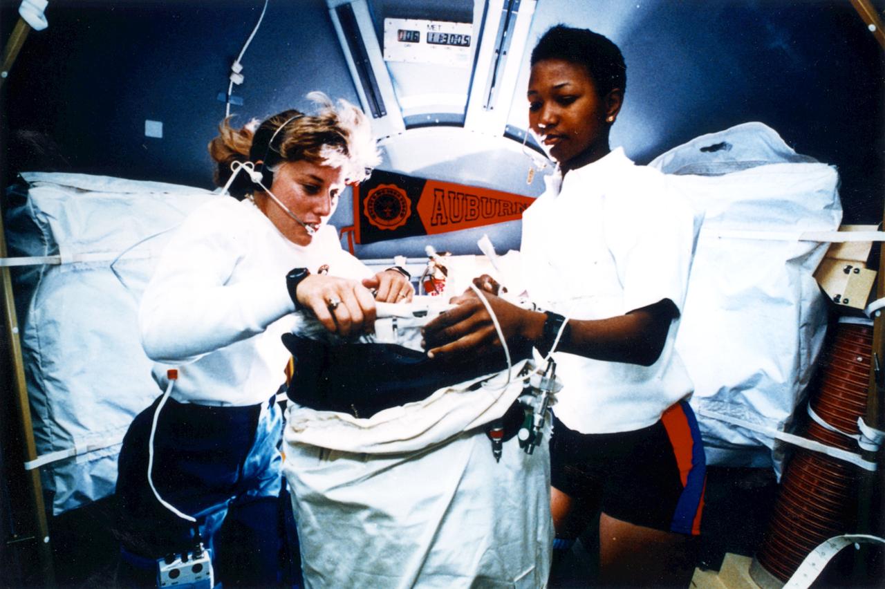 Jan Davis and Mae Jemison working on experiments.