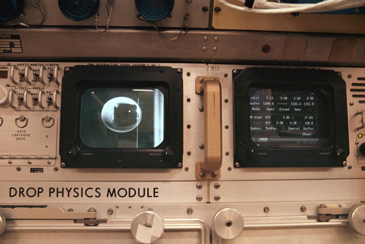 The first United States Microgravity Laboratory (USML-1) was one of NASA's science and technology programs that provided scientists an opportunity to research various scientific investigations in a weightlessness environment inside the Spacelab module. It also provided demonstrations of new equipment to help prepare for advanced microgravity research and processing aboard the Space Station. The USML-1 flew in orbit for extended periods, providing greater opportunities for research in materials science, fluid dynamics, biotechnology (crystal growth), and combustion science. This is a close-up view of the Drop Physics Module (DPM) in the USML science laboratory. The DPM was dedicated to the detailed study of the dynamics of fluid drops in microgravity: their equilibrium shapes, the dynamics of their flows, and their stable and chaotic behaviors. It also demonstrated a technique known as containerless processing. The DPM and microgravity combine to remove the effects of the container, such as chemical contamination and shape, on the sample being studied. Sound waves, generating acoustic forces, were used to suspend a sample in microgravity and to hold a sample of free drops away from the walls of the experiment chamber, which isolated the sample from potentially harmful external influences. The DPM gave scientists the opportunity to test theories of classical fluid physics, which have not been confirmed by experiments conducted on Earth. This image is a close-up view of the DPM. The USML-1 flew aboard the STS-50 mission on June 1992, and was managed by the Marshall Space Flight Center.