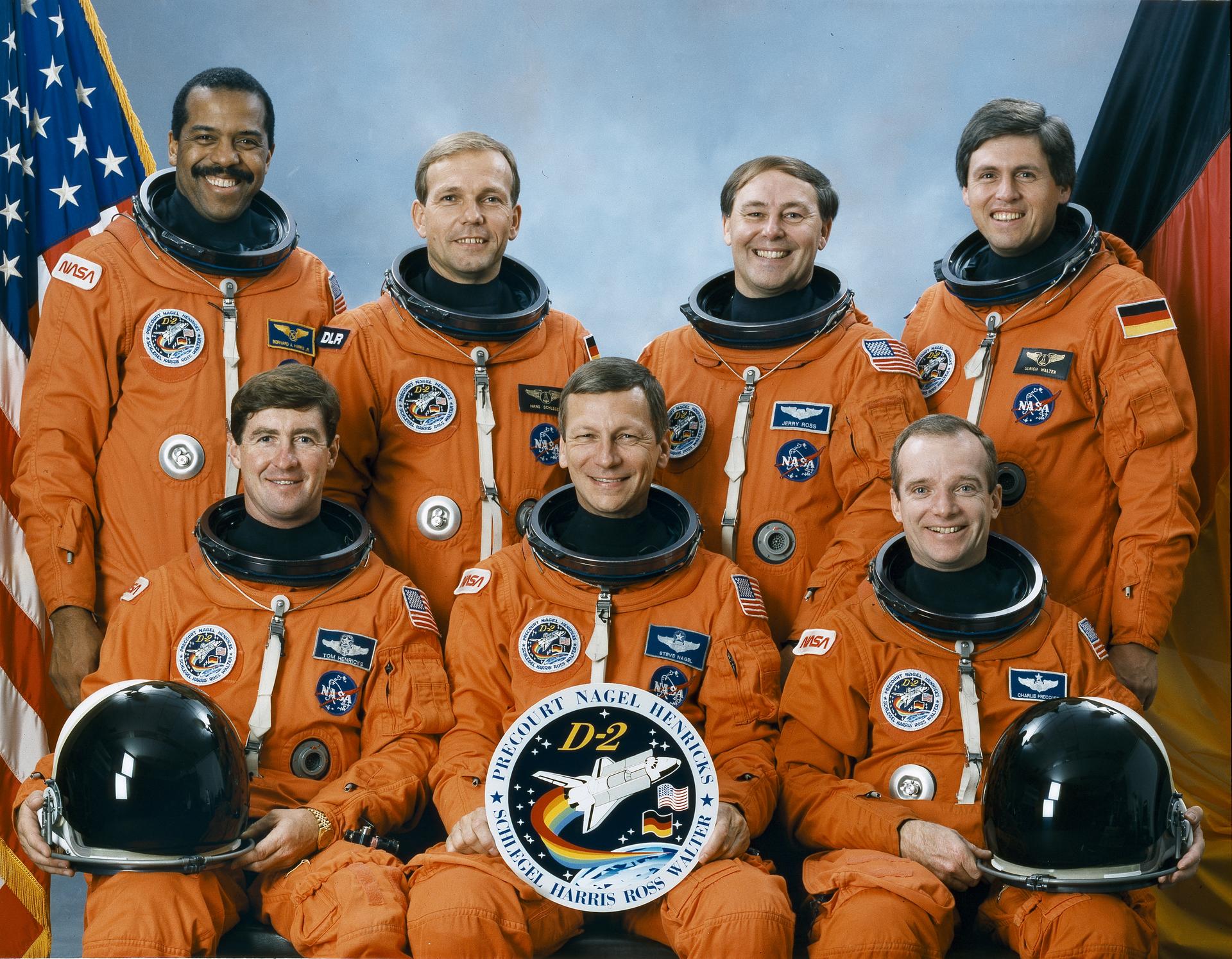 The seven astronauts included in the STS-55 posing for the crew portrait are: (front left to right) Terence (Tom) Henricks, pilot; Steven R. Negal, commander; and Charles J. Precourt, mission specialist. On the back row, from left to right, are Bernard A. Harris, mission specialist; Hans Schlegel, payload specialist; Jerry L. Ross, mission specialist; and Ulrich Walter, payload specialist. The crew launched aboard the Space Shuttle Columbia on April 26, 1993 at 10:50:00 am (EDT).  The major payload was the German Dedicated Spacelab, D2.