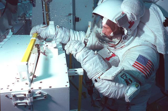 Underwater crew training is conducted in Marshall's Neutral Buoyancy Simulator (NBS) in preparation for on-orbit Hubble Space Telescope (HST) operations.