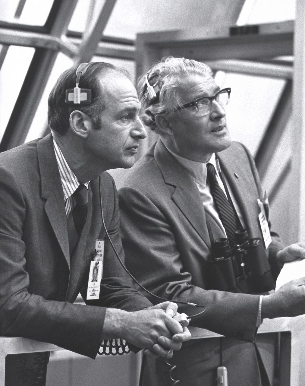 Dr. George M. Lowe, left, Acting Administrator of NASA, and Dr. von Braun monitor the Apollo 14 prelaunch activities in the Firing Room of the Launch Control Center at the Kennedy Space Center. 