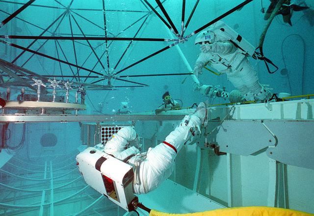 Astronaut Mark Lee participates in the Nitrox breathing system test in Marshall's Neutral Buoyancy Simulator (NBS).