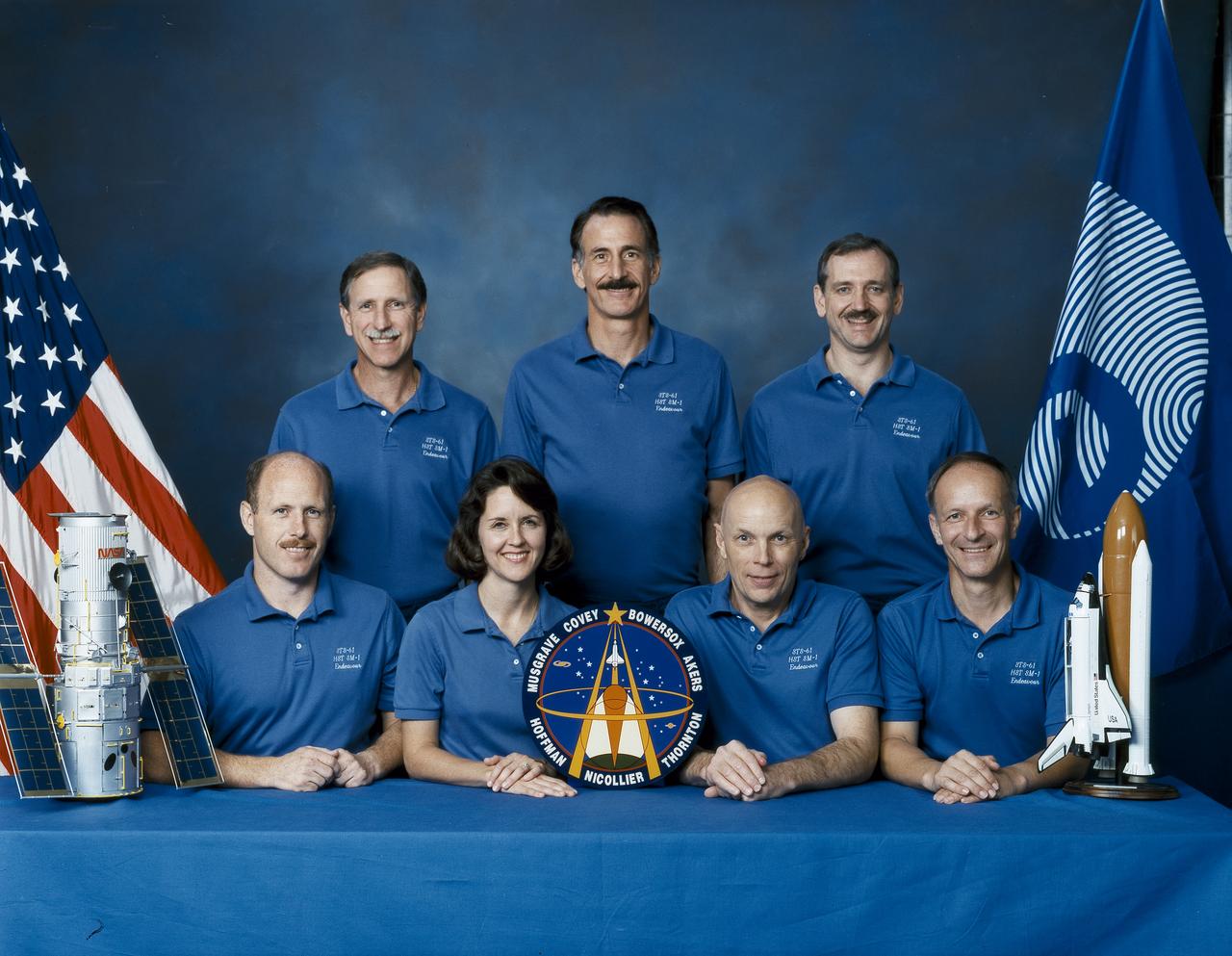 Astronauts included in the STS-61 crew portrait include (standing in rear left to right) Richard O. Covey, commander; and mission specialists Jeffrey A. Hoffman, and Thomas D. Akers. Seated left to right are Kenneth D. Bowersox, pilot; Kathryn C. Thornton, mission specialist; F. Story Musgrave, payload commander; and Claude Nicollier, mission specialist.  Launched aboard the Space Shuttle Endeavor on December 2, 1993 at 4:27:00 am (EST), the STS-61 mission was the first Hubble Space Telescope (HST) servicing mission, and the last mission of 1993.