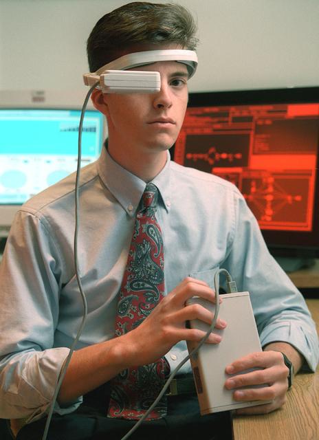 Virtual Reality (VR) can provide cost effective methods to design and evaluate components and systems for maintenance and refurbishment operations. Marshall SPace Flight Center (MSFC) is begirning to utilize VR for design analysis in the X-34 experimental reusable space vehicle. Analysts at MSFC's Computer Applications and Virtual Environments (CAVE) used Head Mounted Displays (HMD) (pictured), spatial trackers and gesture inputs as a means to animate or inhabit a properly sized virtual human model. These models are used in a VR scenario as a way to determine functionality of space and maintenance requirements for the virtual X-34. The primary functions of the virtual X-34 mockup is to support operations development and design analysis for engine removal, the engine compartment and the aft fuselage. This capability provides general visualization support to engineers and designers at MSFC and to the System Design Freeze Review at Orbital Sciences Corporation (OSC).