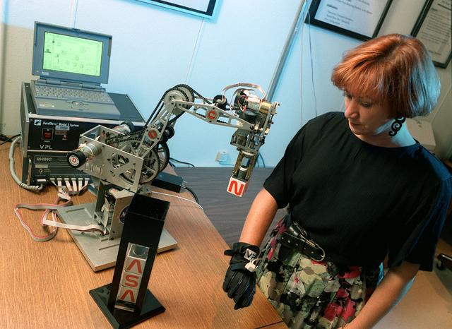 Virtual Reality (VR) can provide cost effective methods to design and evaluate components and systems for maintenance and refurbishment operations. Marshall Spce Flight Center (MSFC) is begirning to utilize VR for design analysis in the X-34 experimental reusable space vehicle. Analysts at MSFC's Computer Applications and Virtual Environments (CAVE) used Head Mounted Displays (HMD) (pictured), spatial trackers and gesture inputs as a means to animate or inhabit a properly sized virtual human model. These models are used in a VR scenario as a way to determine functionality of space and maintenance requirements for the virtual X-34. The primary functions of the virtual X-34 mockup is to support operations development and design analysis for engine removal, the engine compartment and the aft fuselage. This capability provides general visualization support to engineers and designers at MSFC and to the System Design Freeze Review at Orbital Sciences Corporation (OSC).