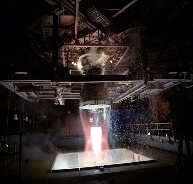 A modified Space Shuttle Main Engine is static fired at Marshall's Technology Test Bed.